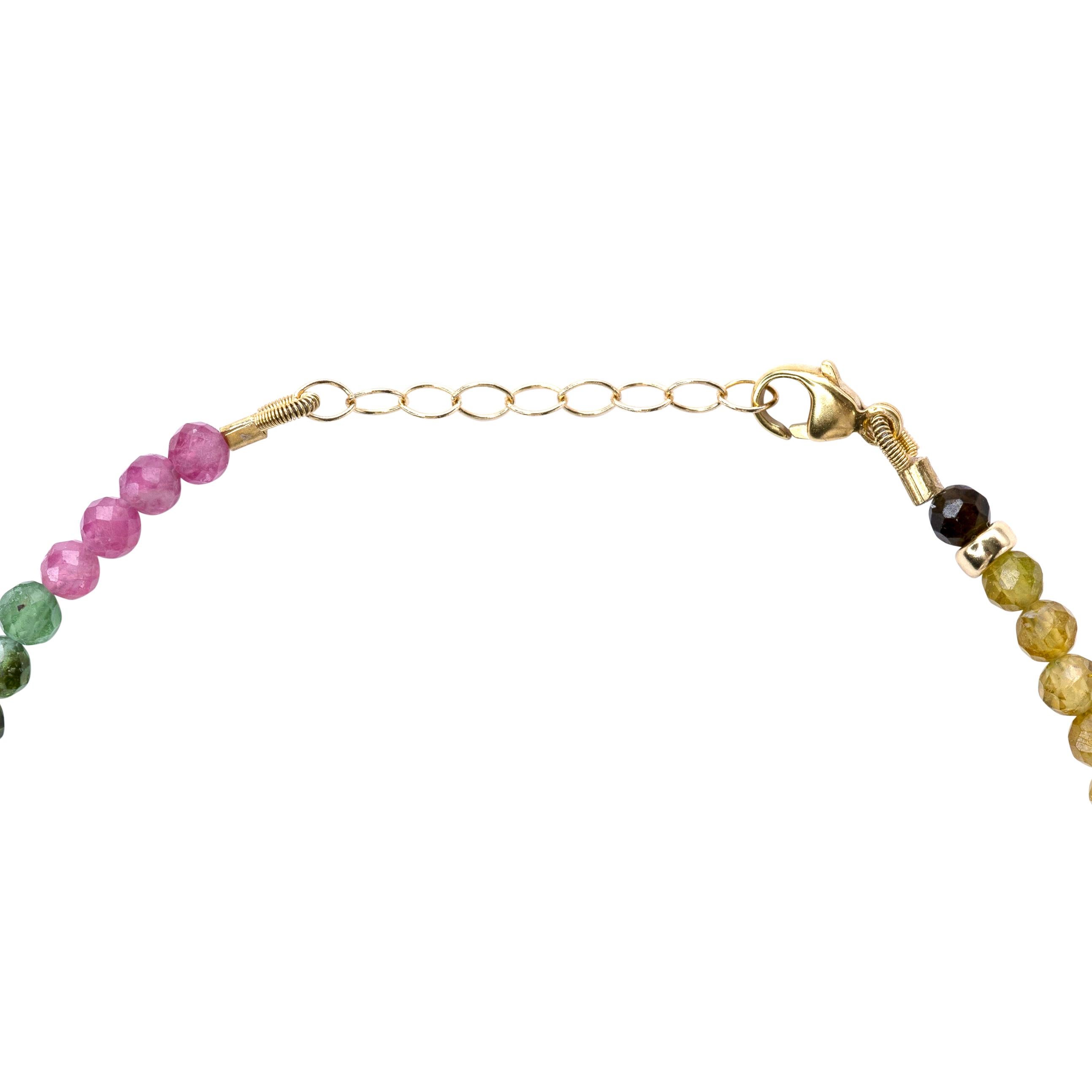 Like capturing a perfect rainbow after a summer shower, this bracelet adorns your wrist with nature's most vibrant palette in miniature. Each tourmaline bead holds a different hue of possibility, creating a personal talisman that awakens joy and