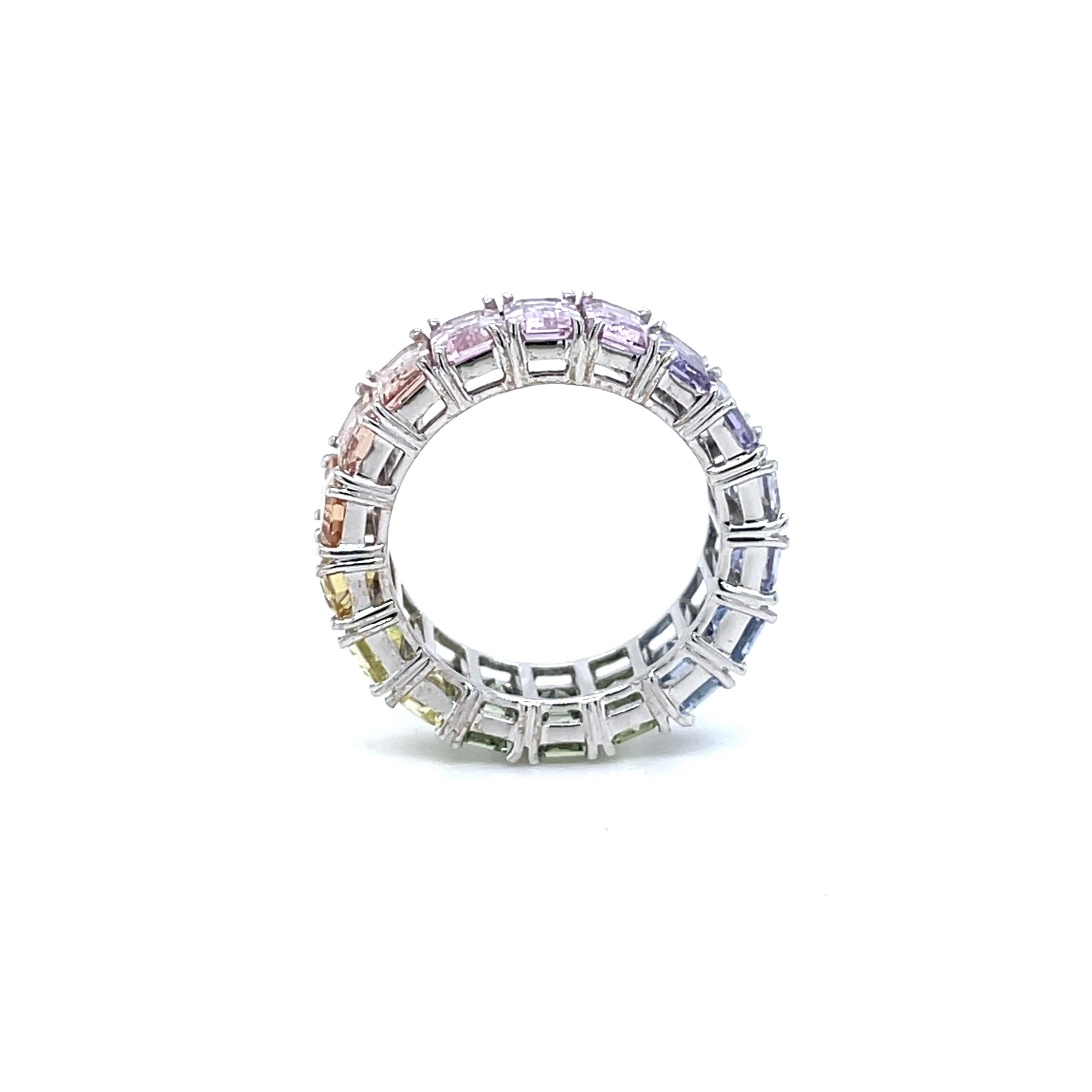 Contemporary Rainbow Unheated Sapphire Emerald Cut Eternity Ring 7.75 CTW in 18K White Gold For Sale