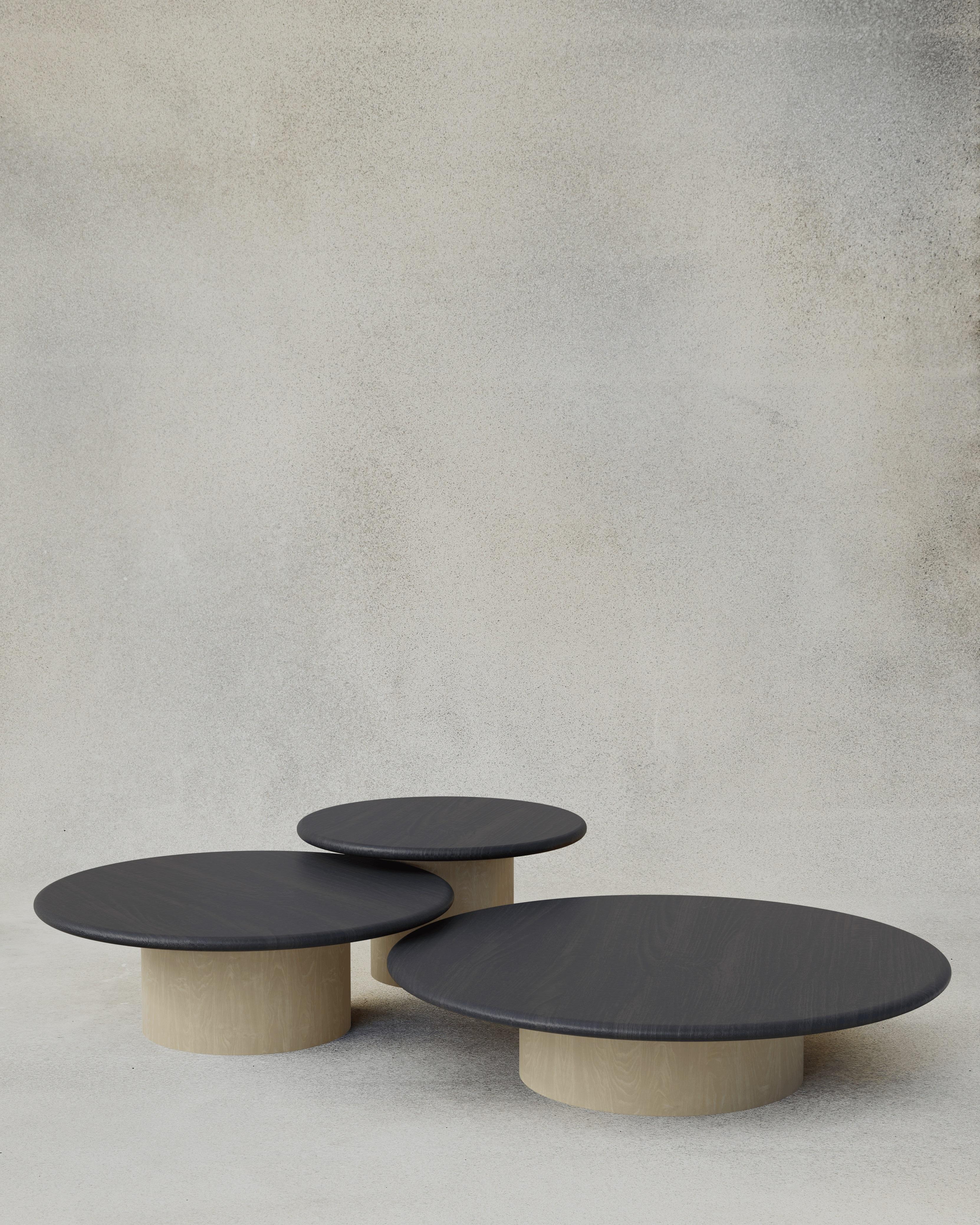 With their circular profiles, varying proportions and potential to be nested, these versatile tables evoke the pattern of raindrops in a pool of water when placed together.

Bought as a set of 600, 800, 1000, we add a 10% discount

Tops: Black