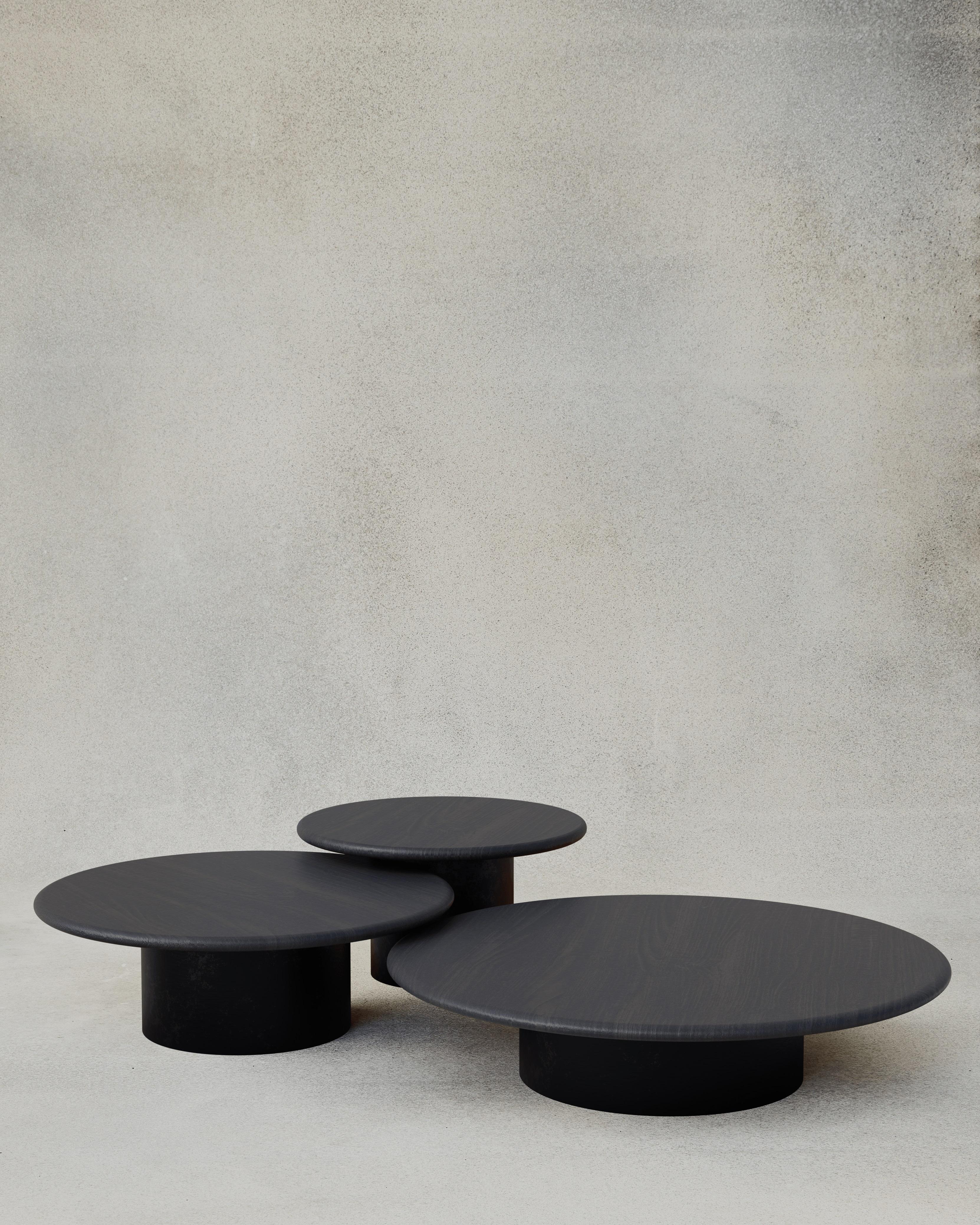 With their circular profiles, varying proportions and potential to be nested, these versatile tables evoke the pattern of raindrops in a pool of water when placed together.

Bought as a set of 600, 800, 1000, we add a 10% discount

Tops: Black