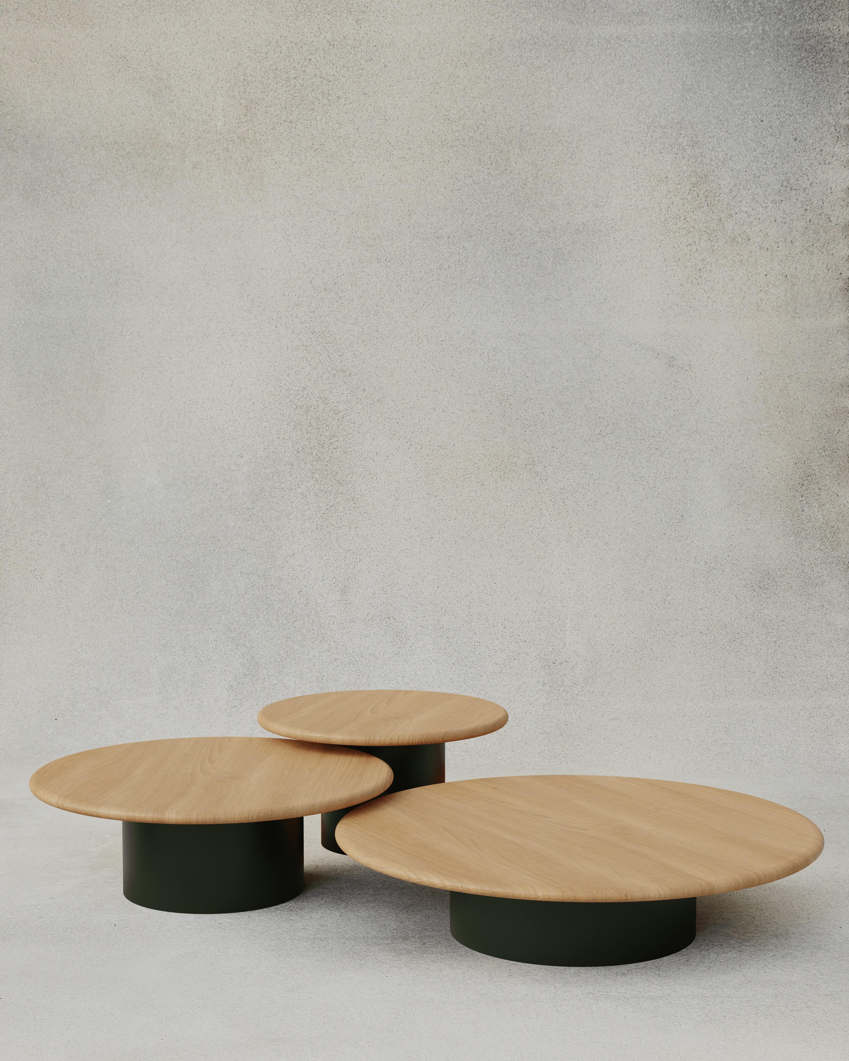 With their circular profiles, varying proportions and potential to be nested, these versatile tables evoke the pattern of raindrops in a pool of water when placed together.

Bought as a set of 600, 800, 1000, we add a 10% discount

Tops: Black