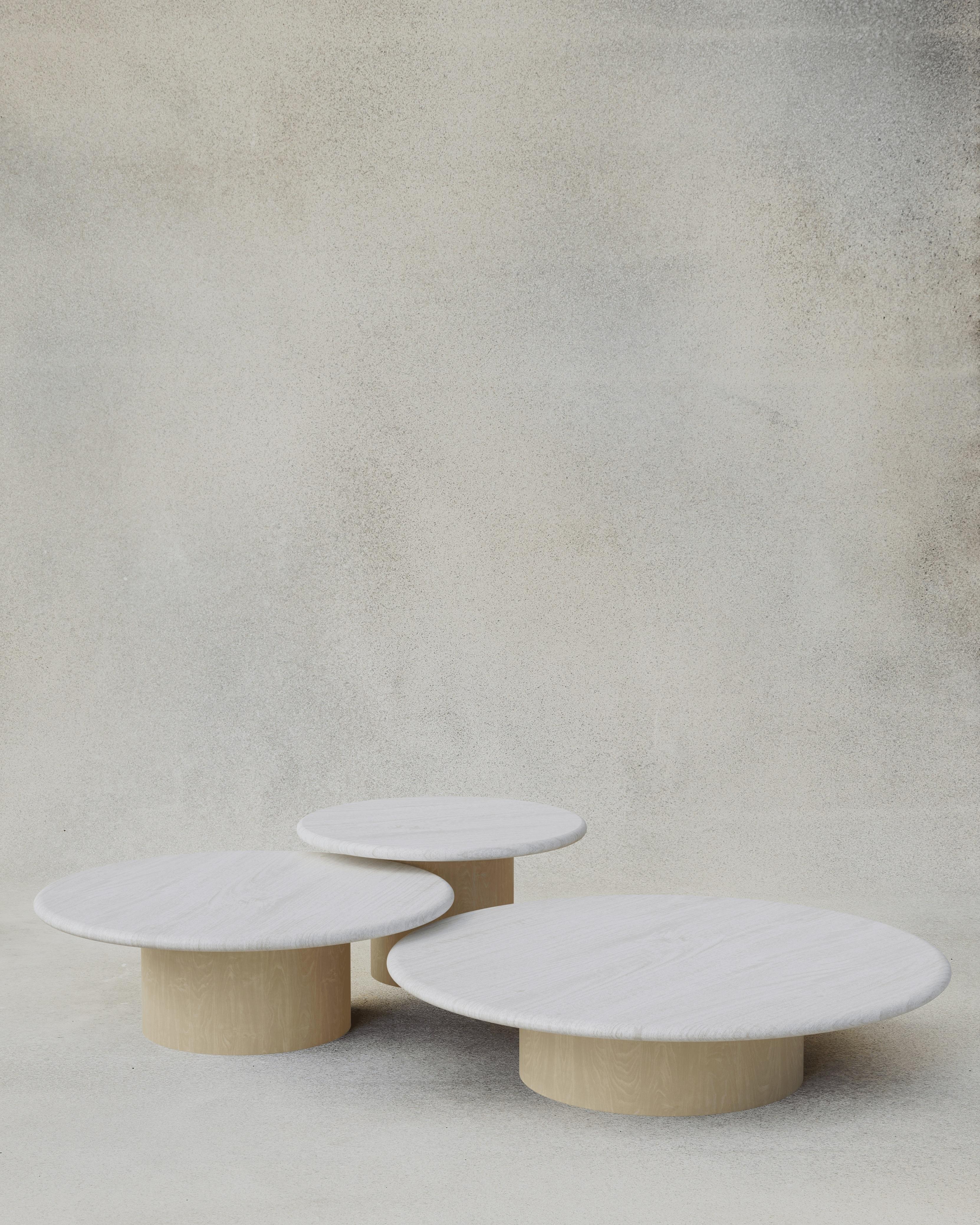 With their circular profiles, varying proportions and potential to be nested, these versatile tables evoke the pattern of raindrops in a pool of water when placed together.

Bought as a set of 600, 800, 1000, we add a 10% discount

Tops: Black