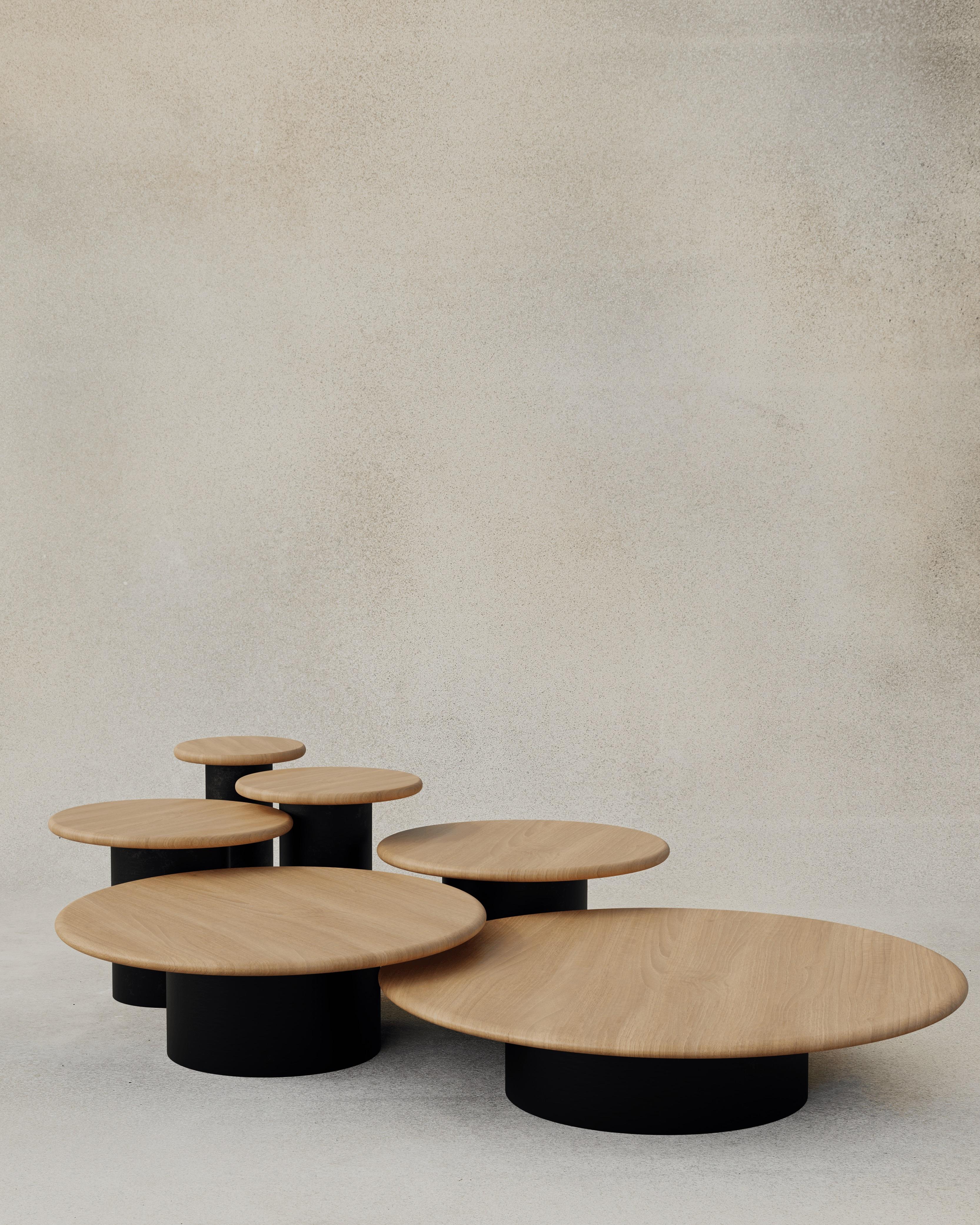 With their circular profiles, varying proportions and potential to be nested, these versatile tables evoke the pattern of raindrops in a pool of water when placed together.

Bought as a full set of 300, 400, 500, 600, 800 and 1000, we add a 10%