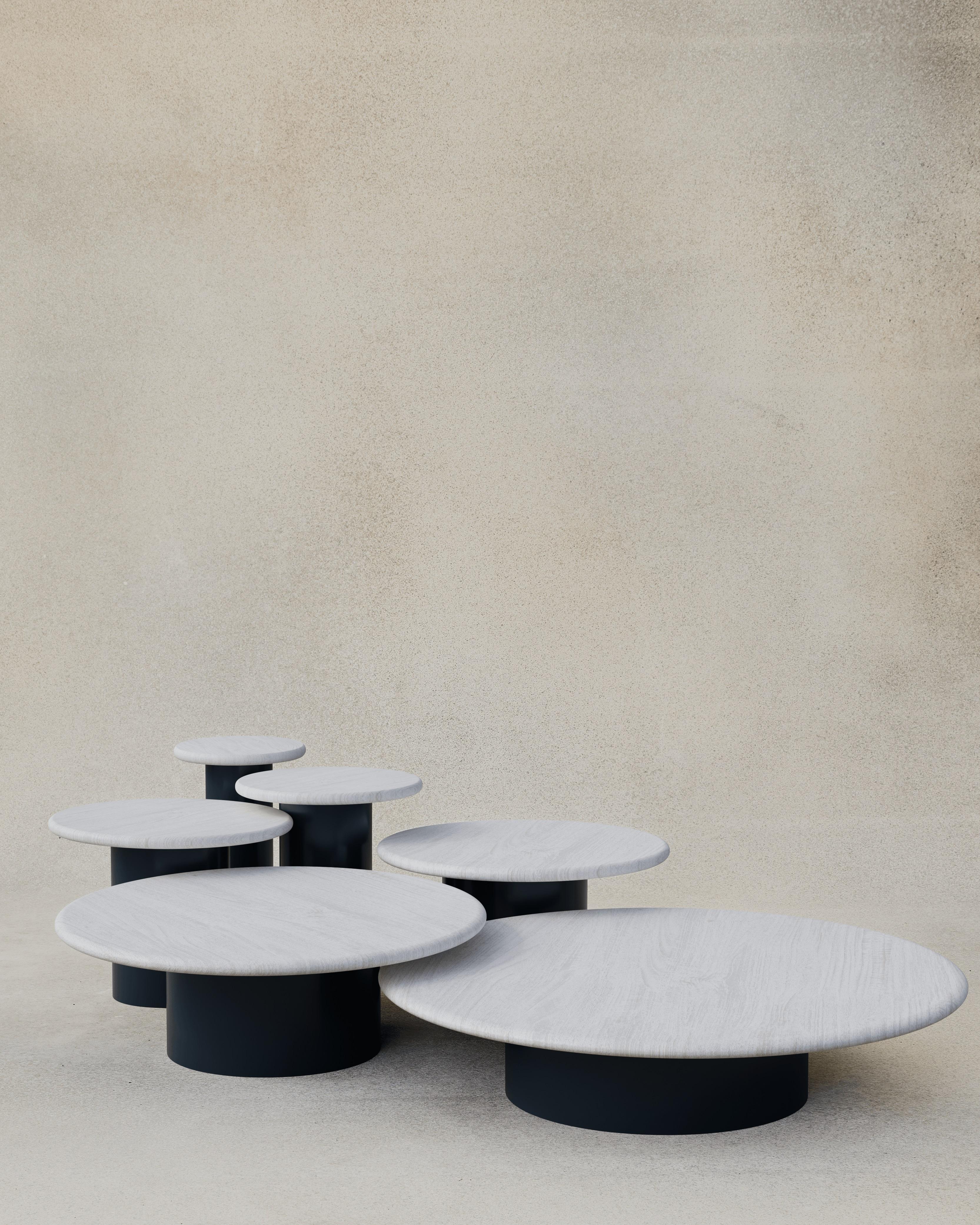 With their circular profiles, varying proportions and potential to be nested, these versatile tables evoke the pattern of raindrops in a pool of water when placed together.

Bought as a full set of 300, 400, 500, 600, 800 and 1000, we add a 10%