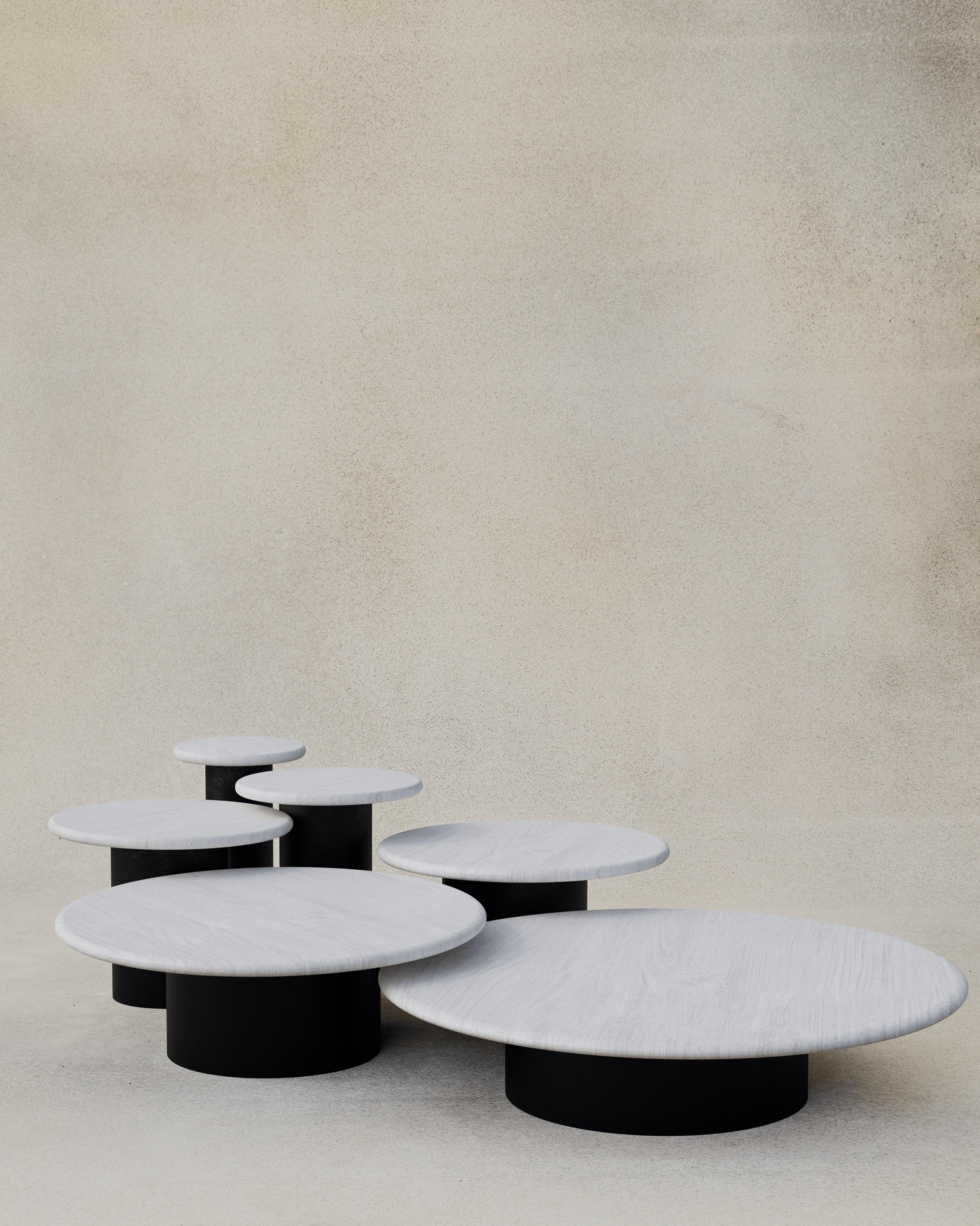 With their circular profiles, varying proportions and potential to be nested, these versatile tables evoke the pattern of raindrops in a POOL of water when placed together.

Bought as a full set of 300, 400, 500, 600, 800 and 1000, we add a 10%