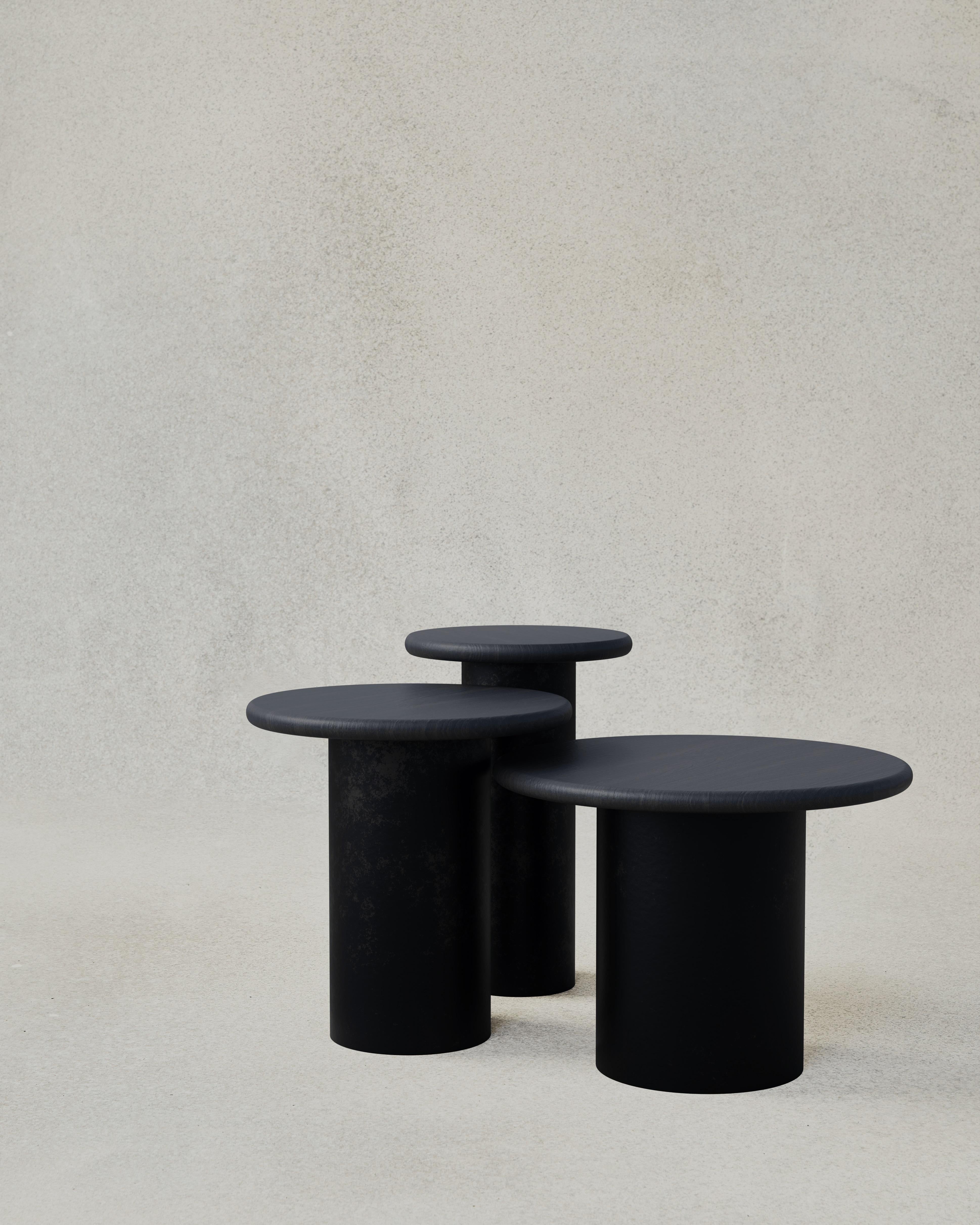 With their circular profiles, varying proportions and potential to be nested, these versatile tables evoke the pattern of raindrops in a POOL of water when placed together.

Bought as a set of 300, 400, 500, we add a 10% discount

Tops: Black