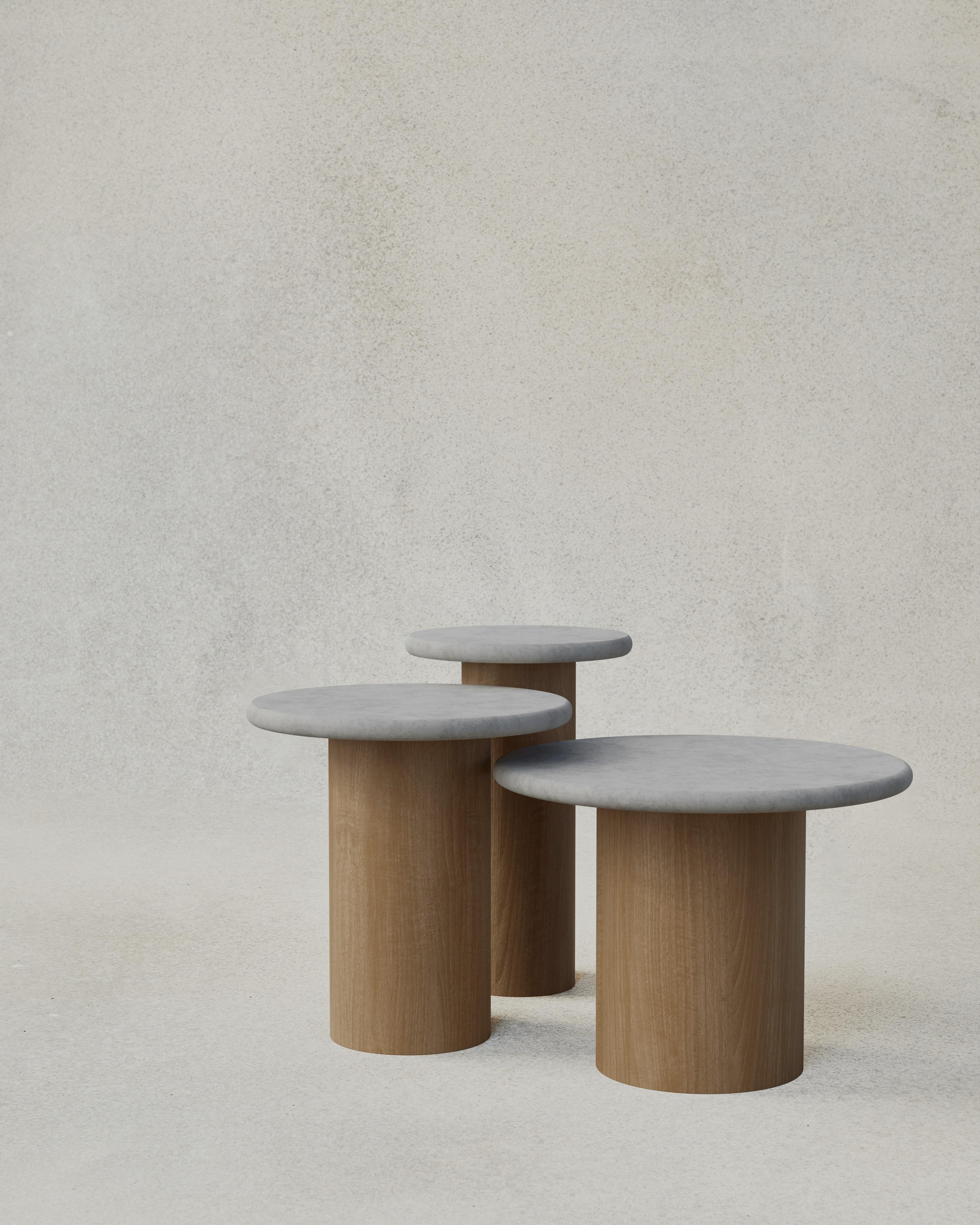 With their circular profiles, varying proportions and potential to be nested, these versatile tables evoke the pattern of raindrops in a pool of water when placed together.

Bought as a set of 300, 400, 500, we add a 10% discount

Tops: Black