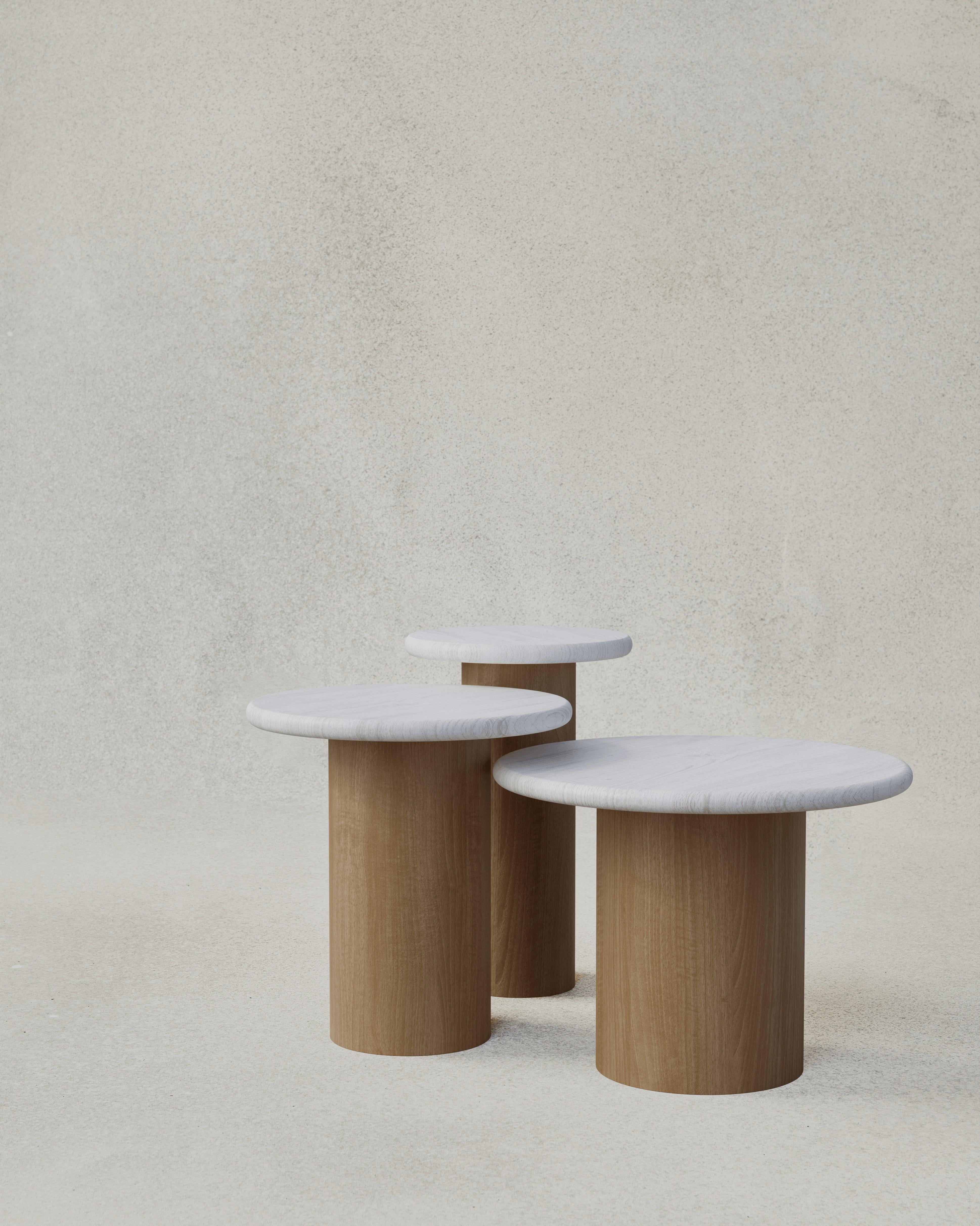 With their circular profiles, varying proportions and potential to be nested, these versatile tables evoke the pattern of raindrops in a pool of water when placed together.

Bought as a set of 300, 400, 500, we add a 10% discount

Tops: Black