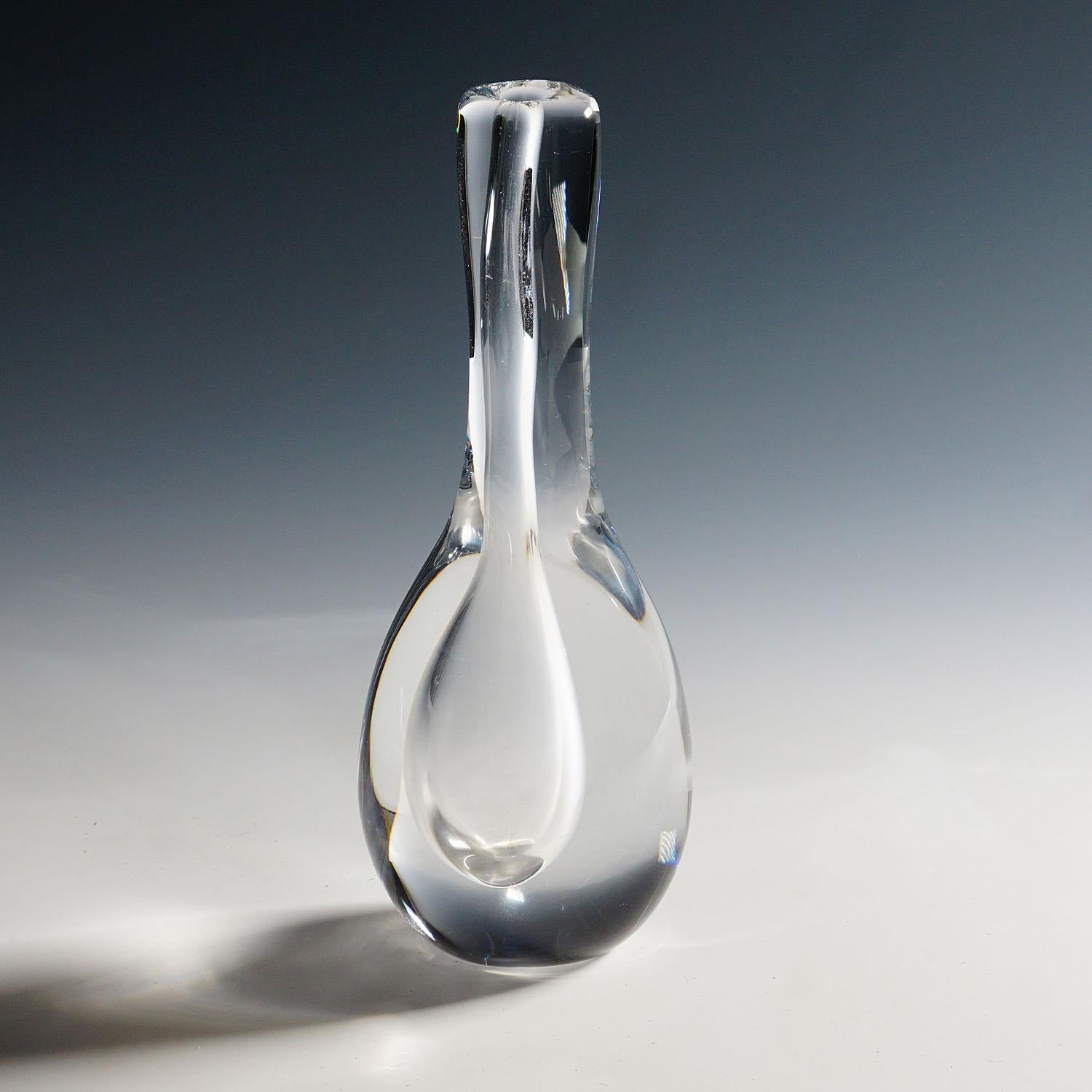 Raindrop Vase by Göran Wärff for Kosta 1980s

A vintage art glass vase designed by Göran Wärff and manufactured by Kosta Glasbruk ca. 1980s. Made of thick handblown lead crystal glass. The vase is signed with 
