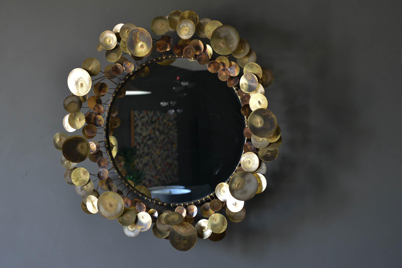 Raindrops mirror in brass by C. Jere, 1968. Original vintage piece, not a current reproduction. Beautiful condition with no cracks or chips to the mirror or missing discs. Wonderful brass patina. Ready to hang, weighs approximate 30