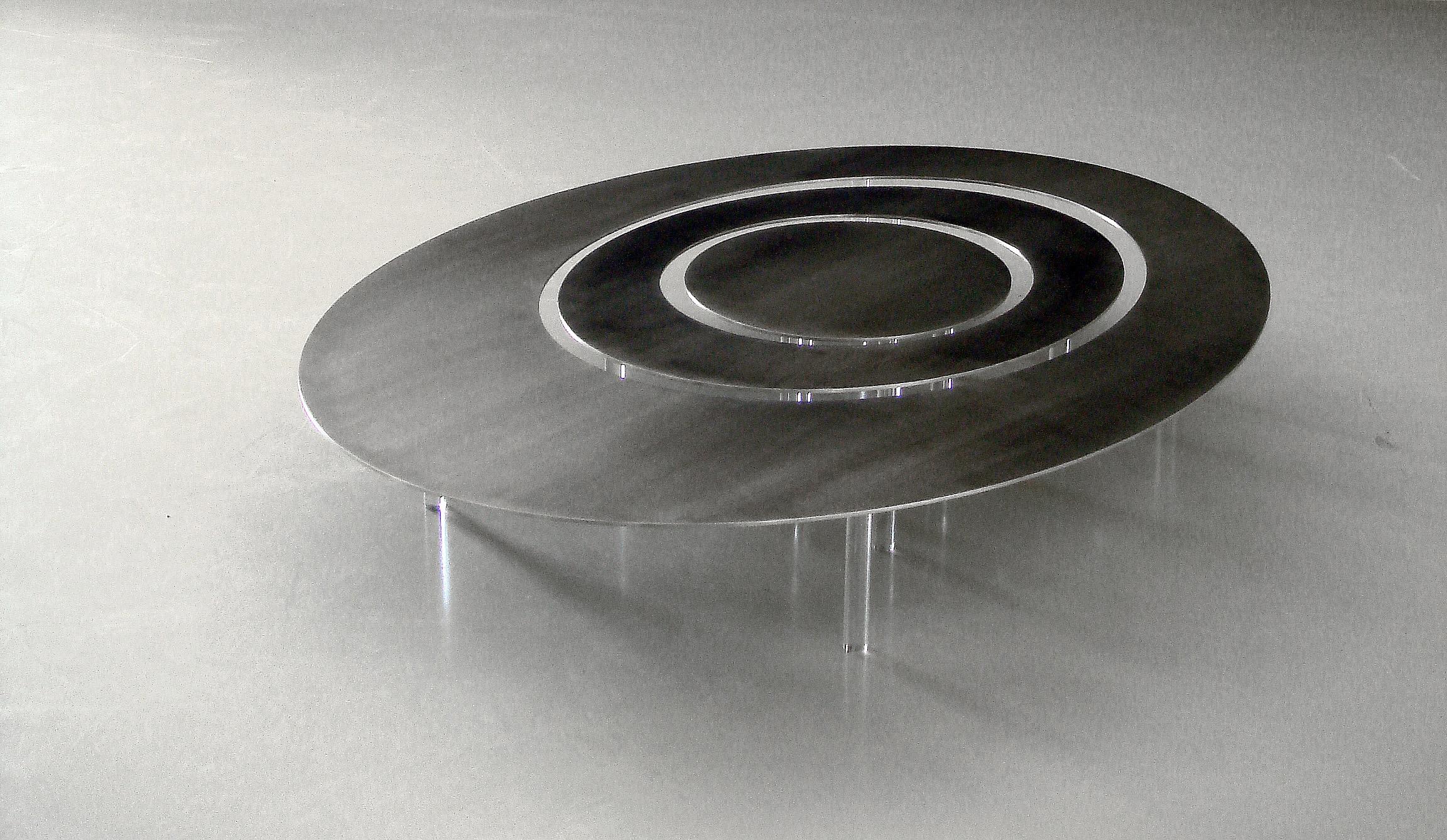 Raindrops is an oval shaped coffee table, made of three individual pieces. To be used as one single item or three separate ones.

Top in laser-cut, satin polished stainless steel; and legs in circular transparent acrylic.

Total dimensions: 152