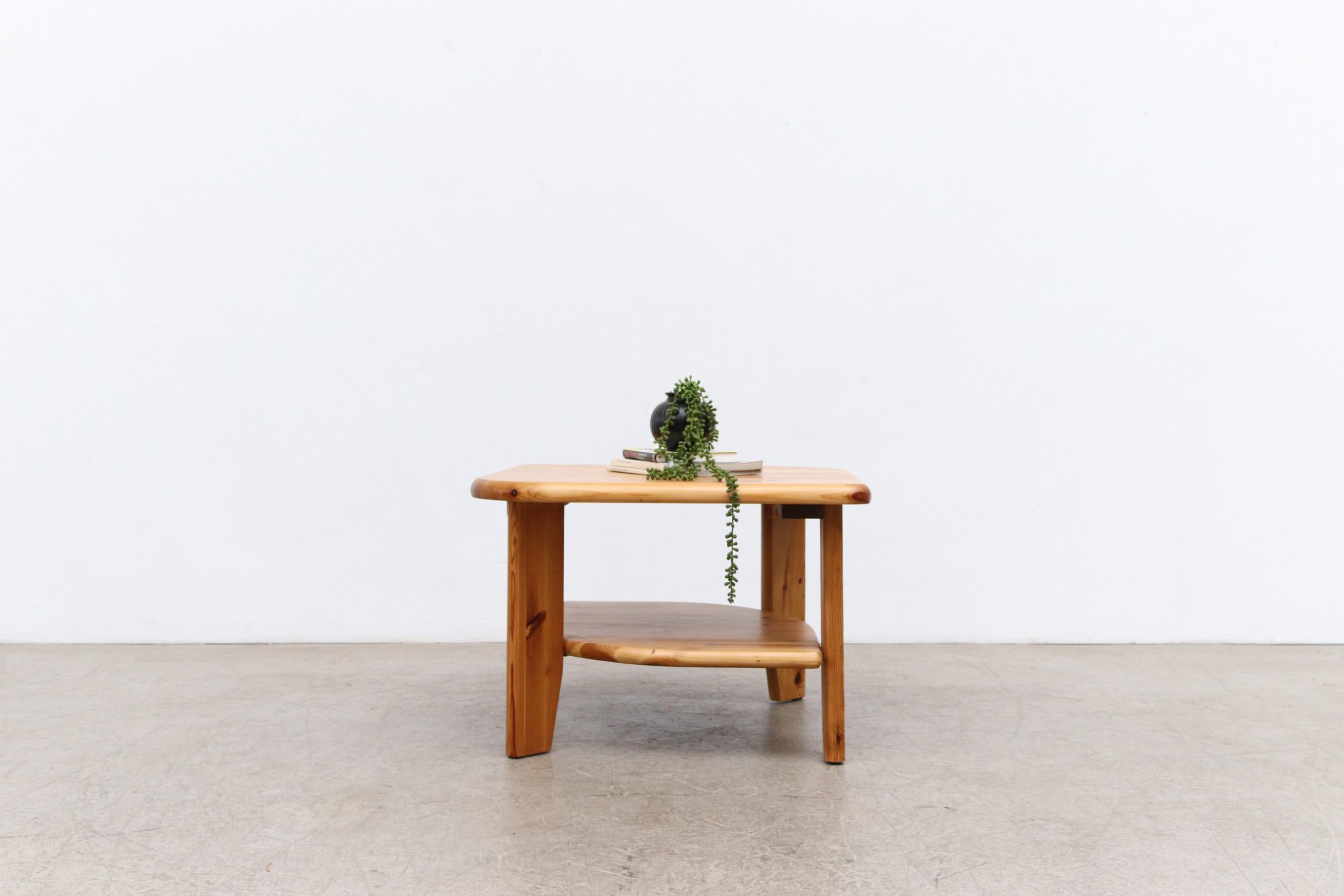 Rainer Daumiller attributed asymmetric side or coffee table with lower shelf in beautiful natural pine. In good condition. Two available and one in a darker stain version also available, listed separately, (LU922442466382).