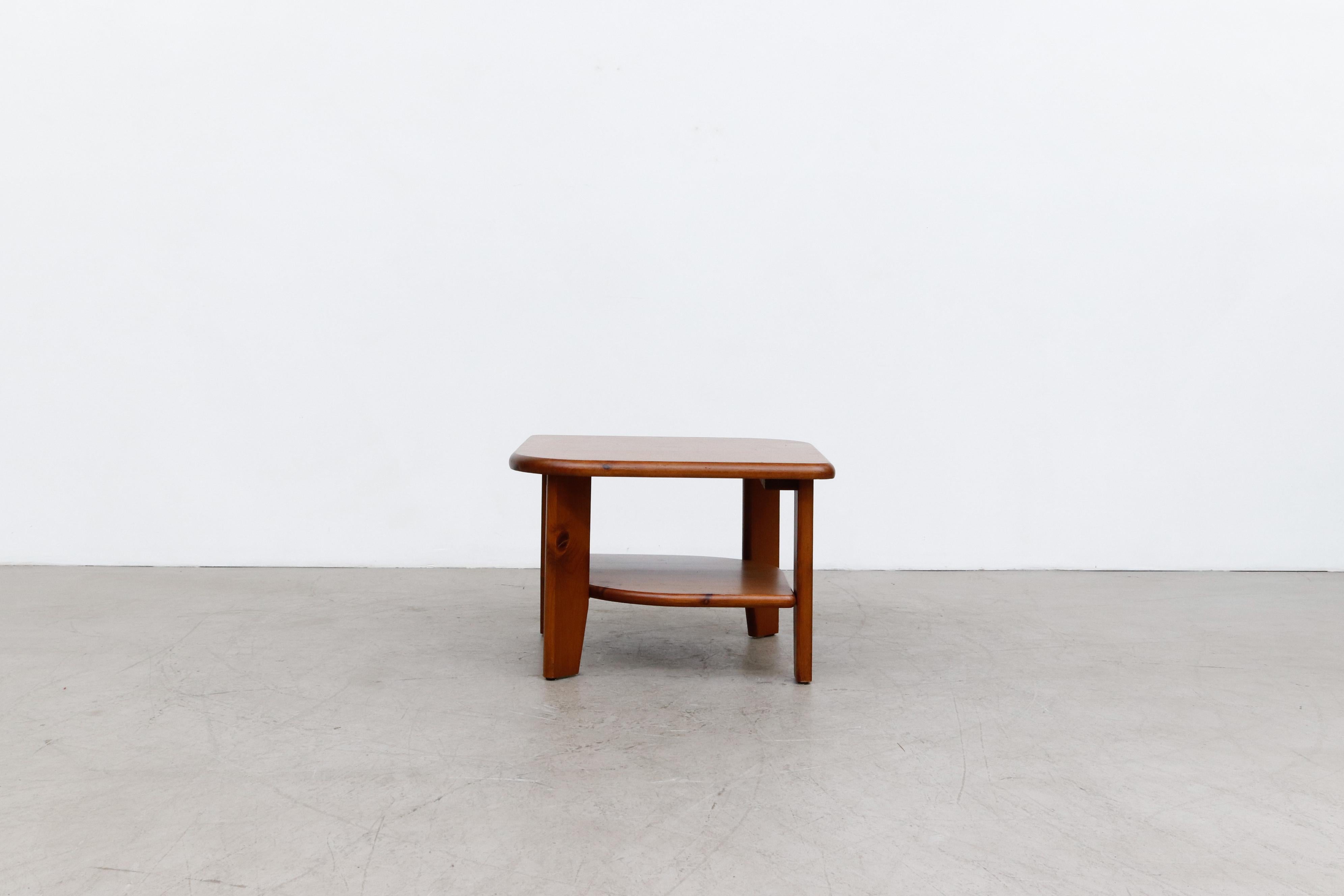 Rainer Daumiller attributed dark stained pine asymmetric side table with lower shelf. In lightly refinished condition, With some sign of wear including minor scuffs and scratches. Actual table may differ slightly from the one shown in images.