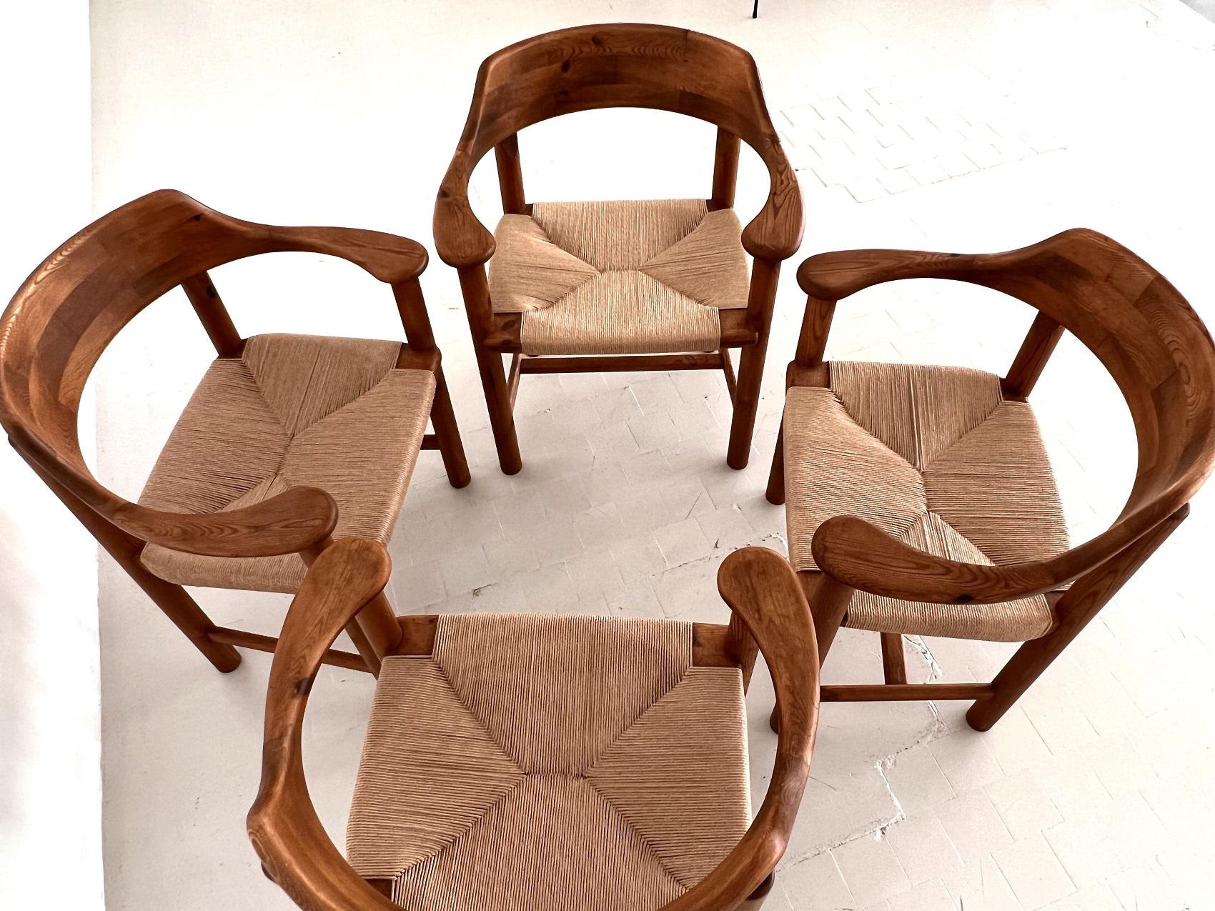 Rainer Daumiller, pinewood, paper cord, Denmark, 1970s

Beautiful, organic and natural set of 4 armchairs or dining chairs in solid darkened pine.
Gorgeous natural expression and grain of the colored wood. 
The woven seat in paper cord gives the