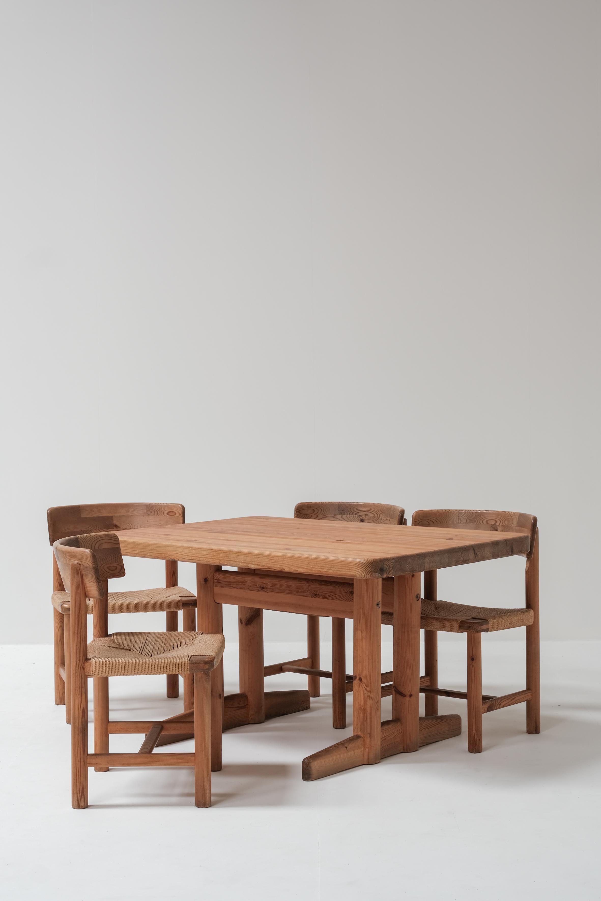 This beautiful dining set, designed by Rainer Daumiller in Denmark during the 1960s, is crafted entirely from pine, showcasing the designer’s love for natural materials and simple, functional design.

The set consists of four chairs with handwoven