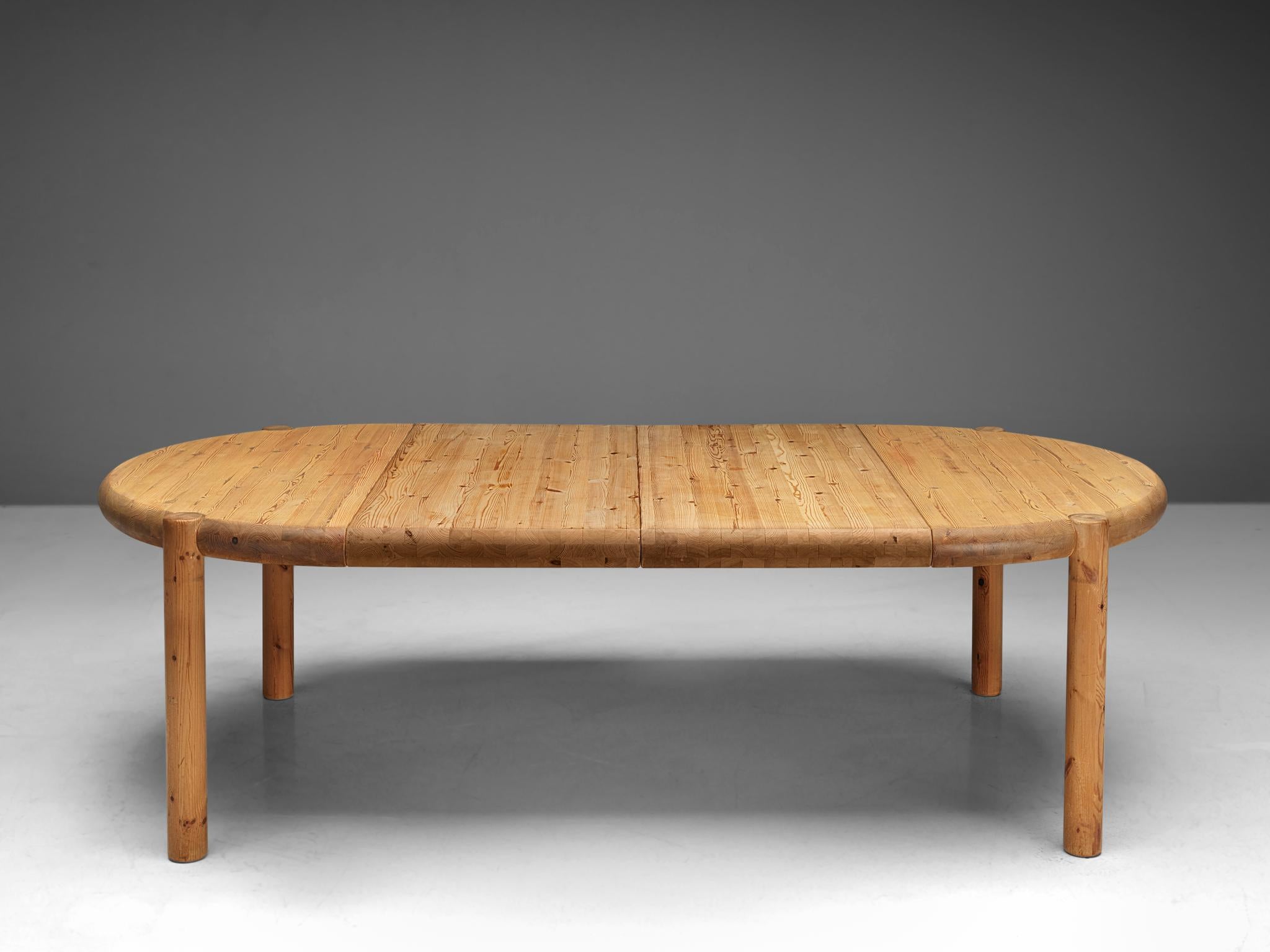 Rainer Daumiller, extendable dining table, pine, Denmark, 1970s

Robust dining table in solid pine, designed by Rainer Daumiller. A functional design that features a rounded tabletop when not extended and an oval top when the two leaves are added to