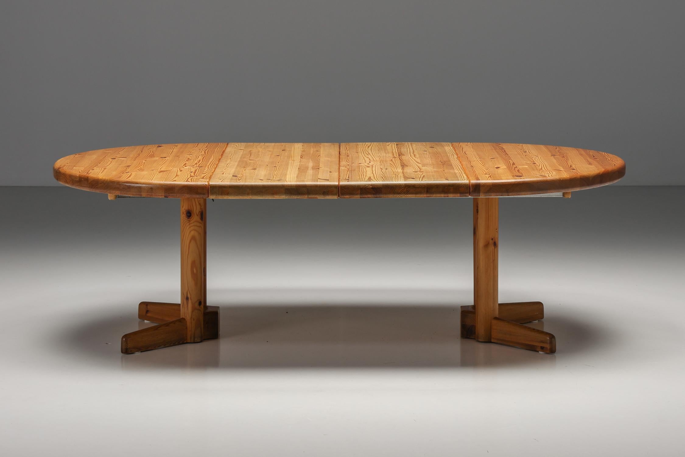 Rainer Daumiller extendable dining table in solid pine, Danish design, 1970's, Scandinavian modern; 

Scandinavian modern round-oval dining table designed by Rainer Daumiller in Denmark in the 1970s. This dining table is extendable and has three