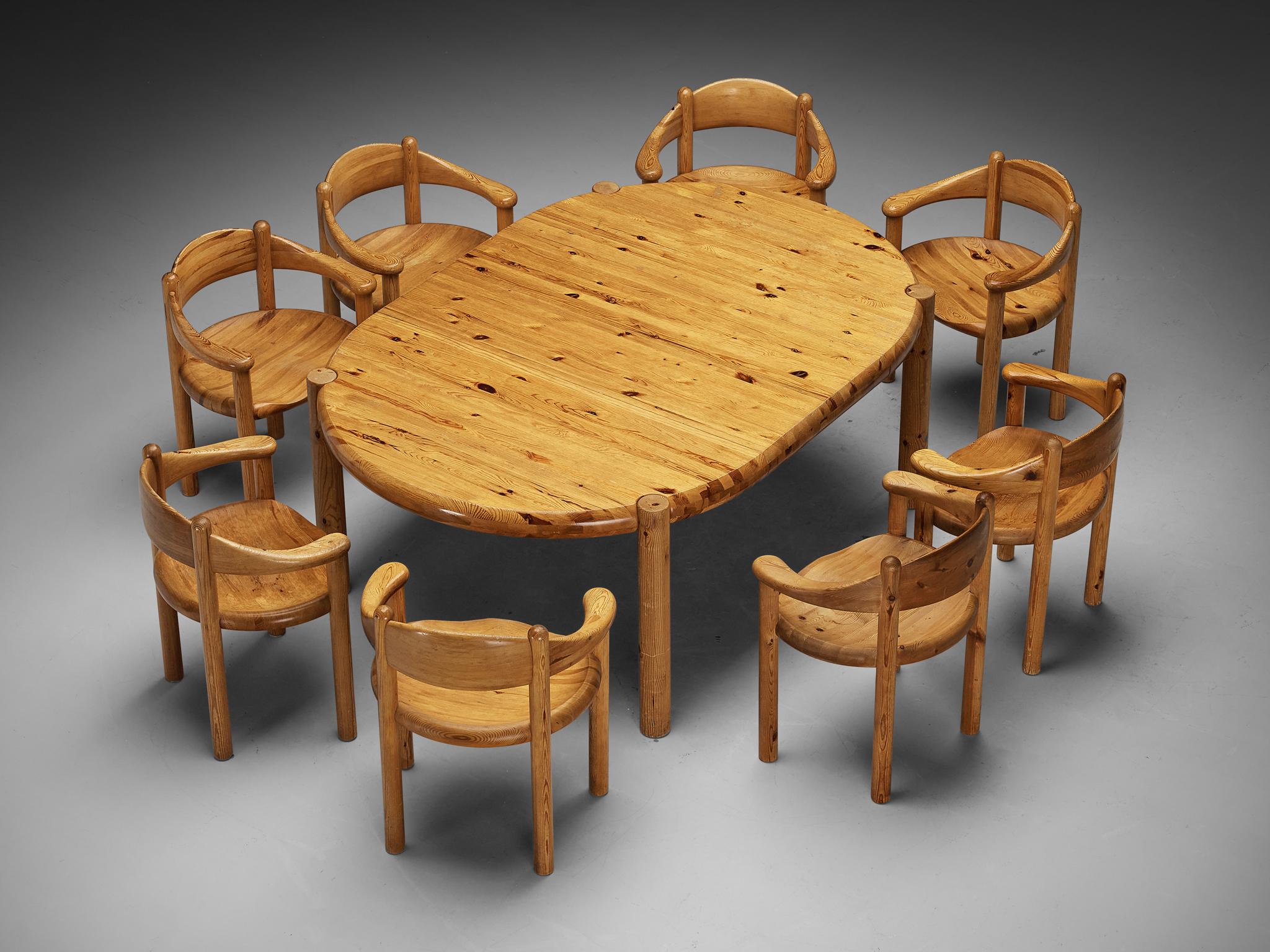 Rainer Daumiller, set of dining table with eight armchairs, pine, Denmark, 1970s.

This dining room set contains an extendable dining table and eight dining chairs, designed by Rainer Daumiller. The table can be configured into two versions by means