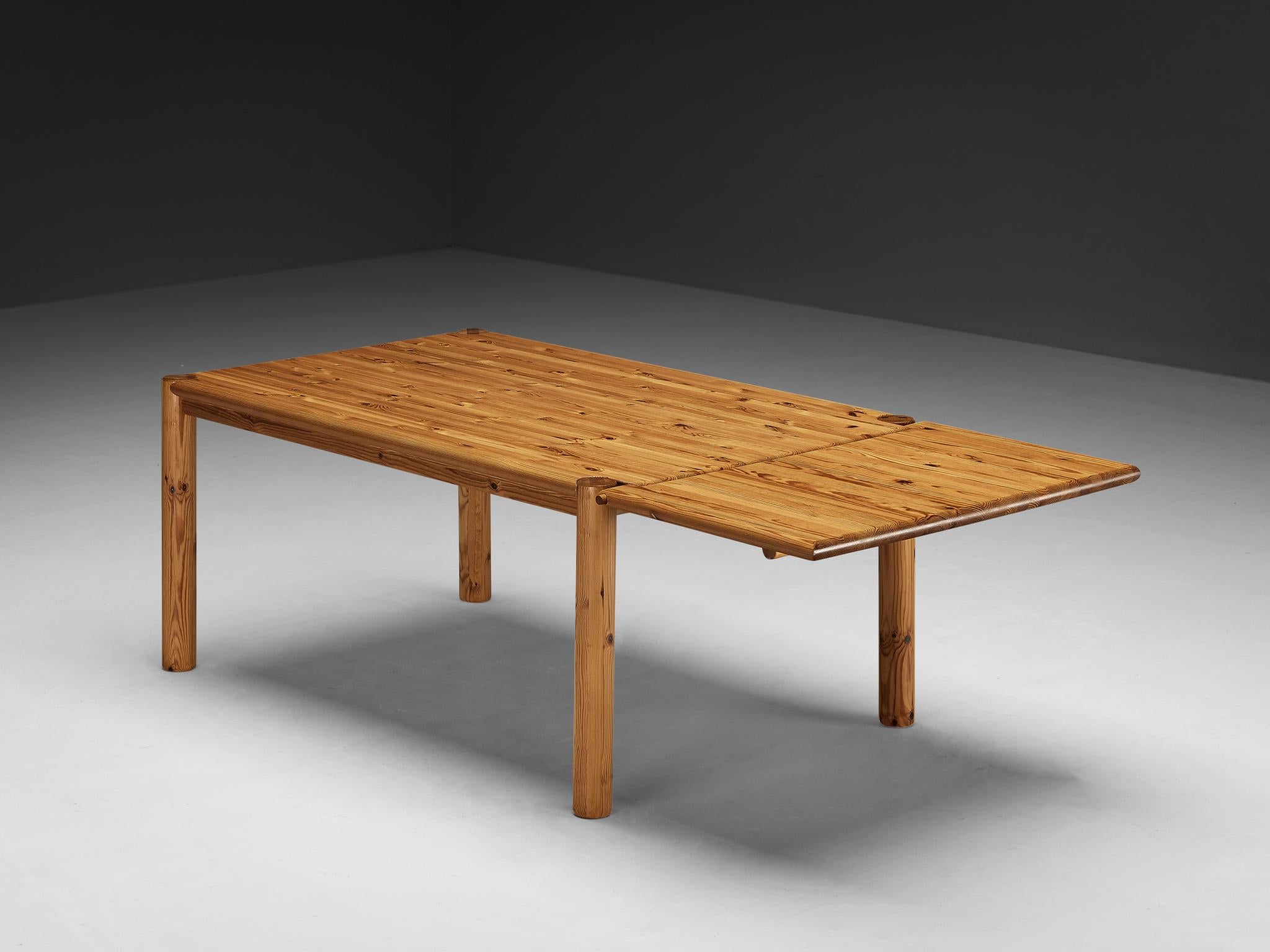 Rainer Daumiller, extendable drop-leaf dining table, solid pine, Denmark, 1970s

This rectangular dining table by Rainer Daumiller can be configured into a larger version by means of an extendable drop-leaf feature. The tabletop is held in place