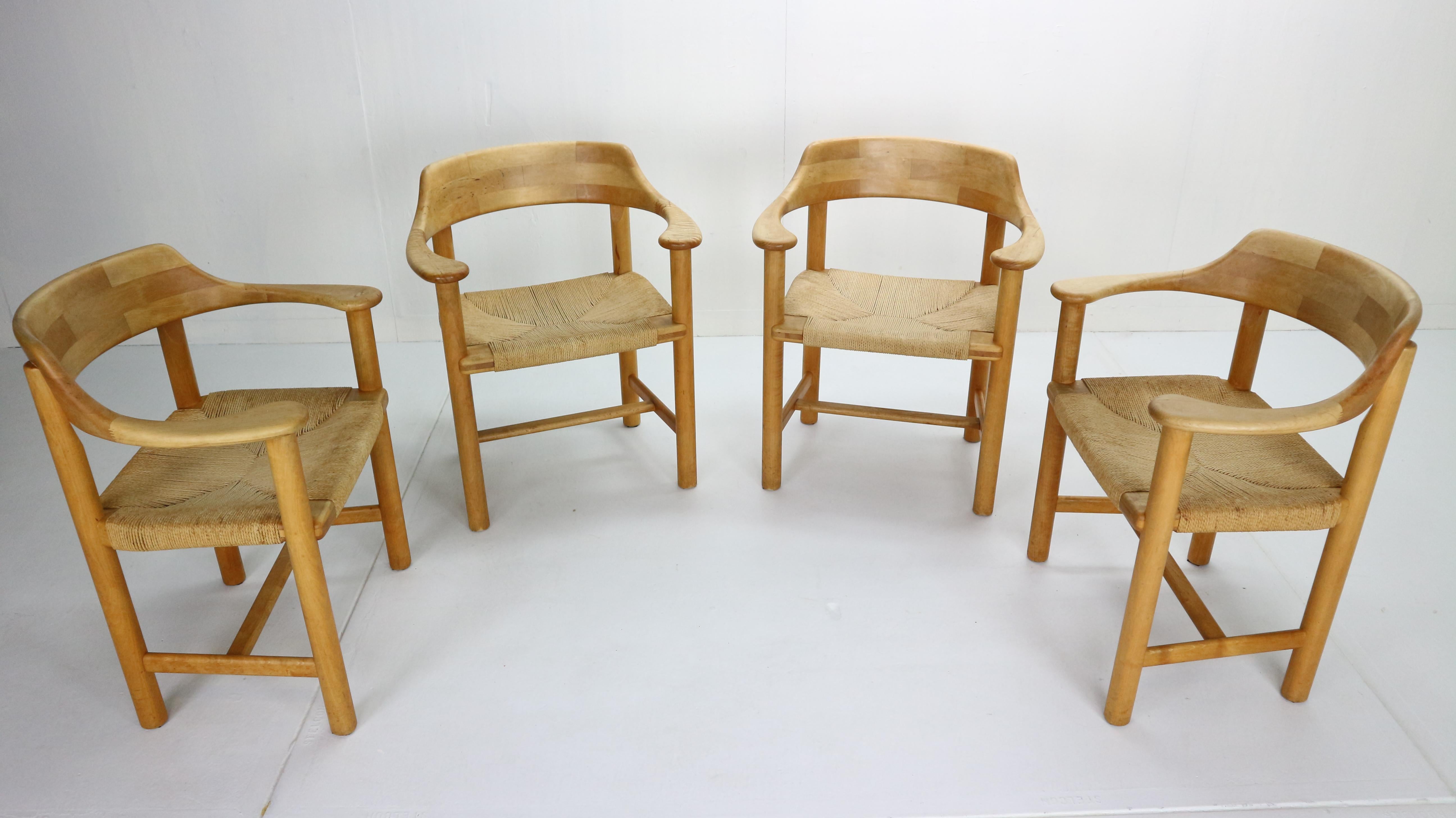Sculptural, beautiful organic shaped dining chairs in pine wood and paper cord by Rainer Daumiller, manufactured for Hirtshals Sawmill, Denmark in 1970s.
Beautifully carved organic lines of grained pine-wood frame and paper cord seating gives the