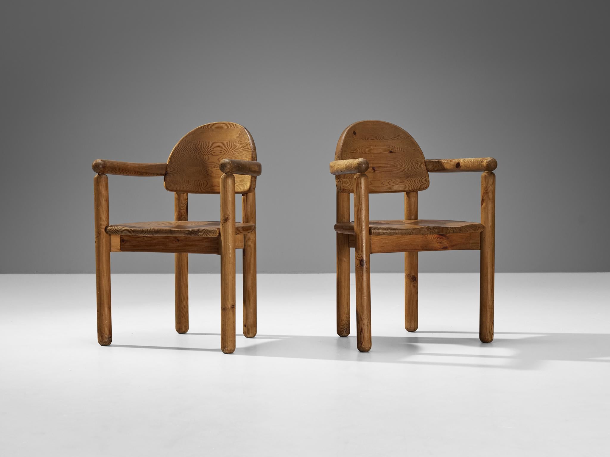 Rainer Daumiller for Hirtshals Savvaerk, pair of armchairs, pine, Denmark, 1970s.
 
These dining chairs by Danish designer Rainer Daumiller have multiple features. The vivid grain of the warm pine wood contributes to the natural expressiveness of