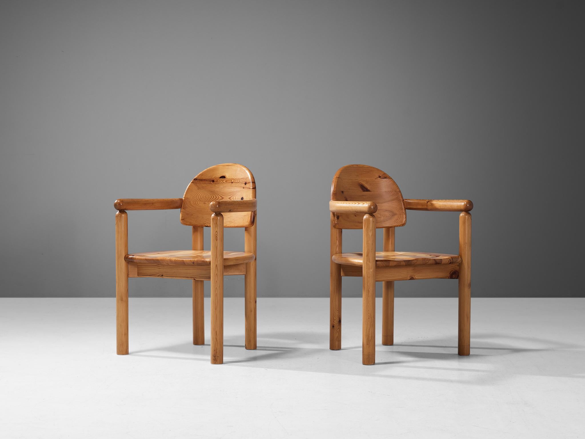 Rainer Daumiller for Hirtshals Savvaerk, pair of armchairs, pine, Denmark, 1970s.
 
This pair of armchairs by Danish designer Rainer Daumiller has multiple features. The vivid grain of the warm pine wood contributes to the natural expressiveness of