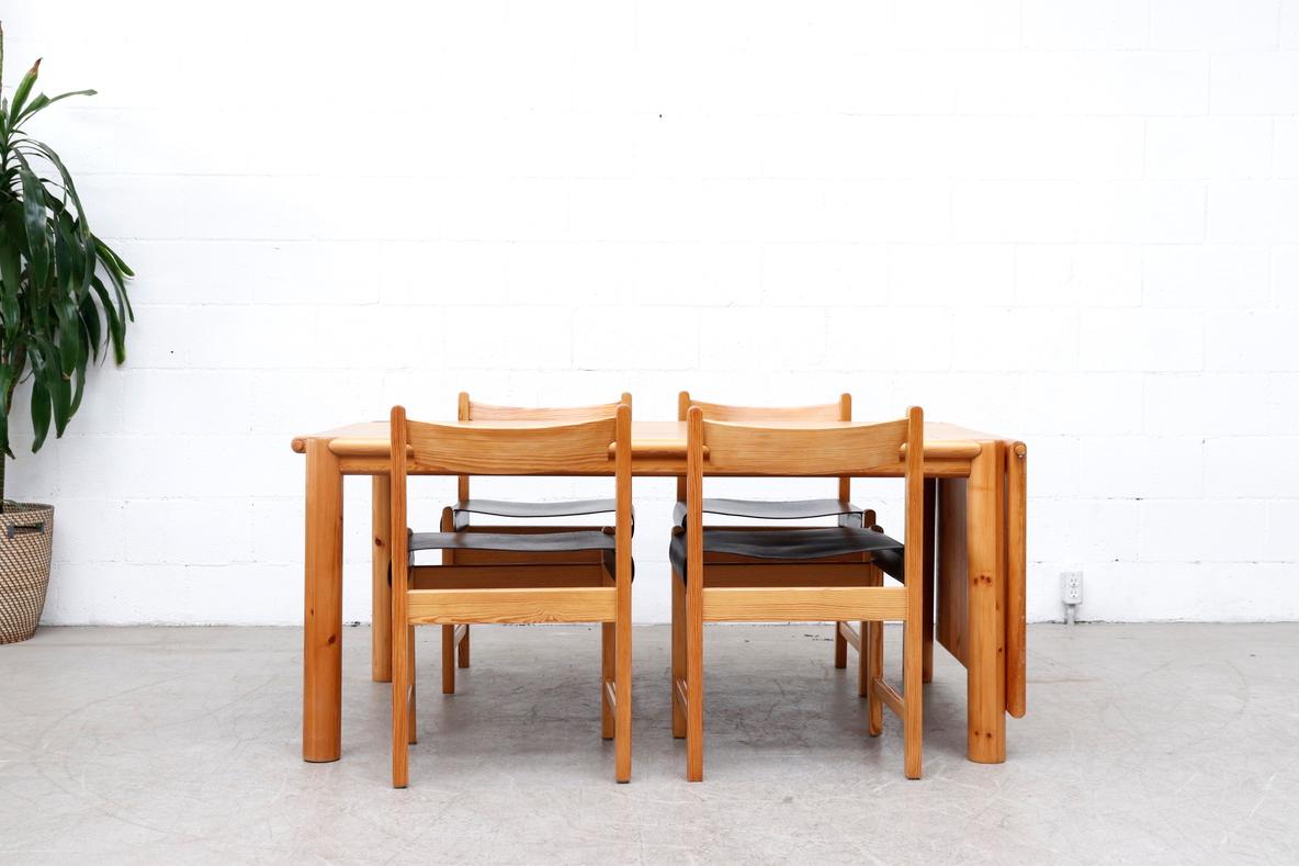 Gorgeous pine dining table by Rainer Daumiller for Hirtshals Savvaerk, Denmark. Lightly refinished rectangle dining table with one drop down or removable leaf and fat round legs. In original condition with minimal wear consistent with age and use.  