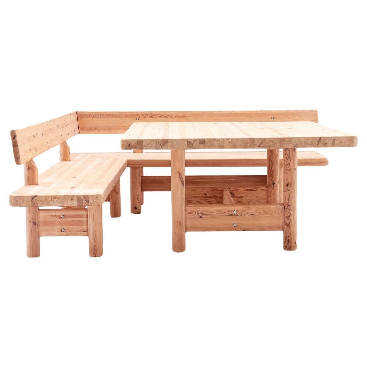 Rainer Daumiller. Set of a table and two benches in larch. 1980s. LS57051009B For Sale