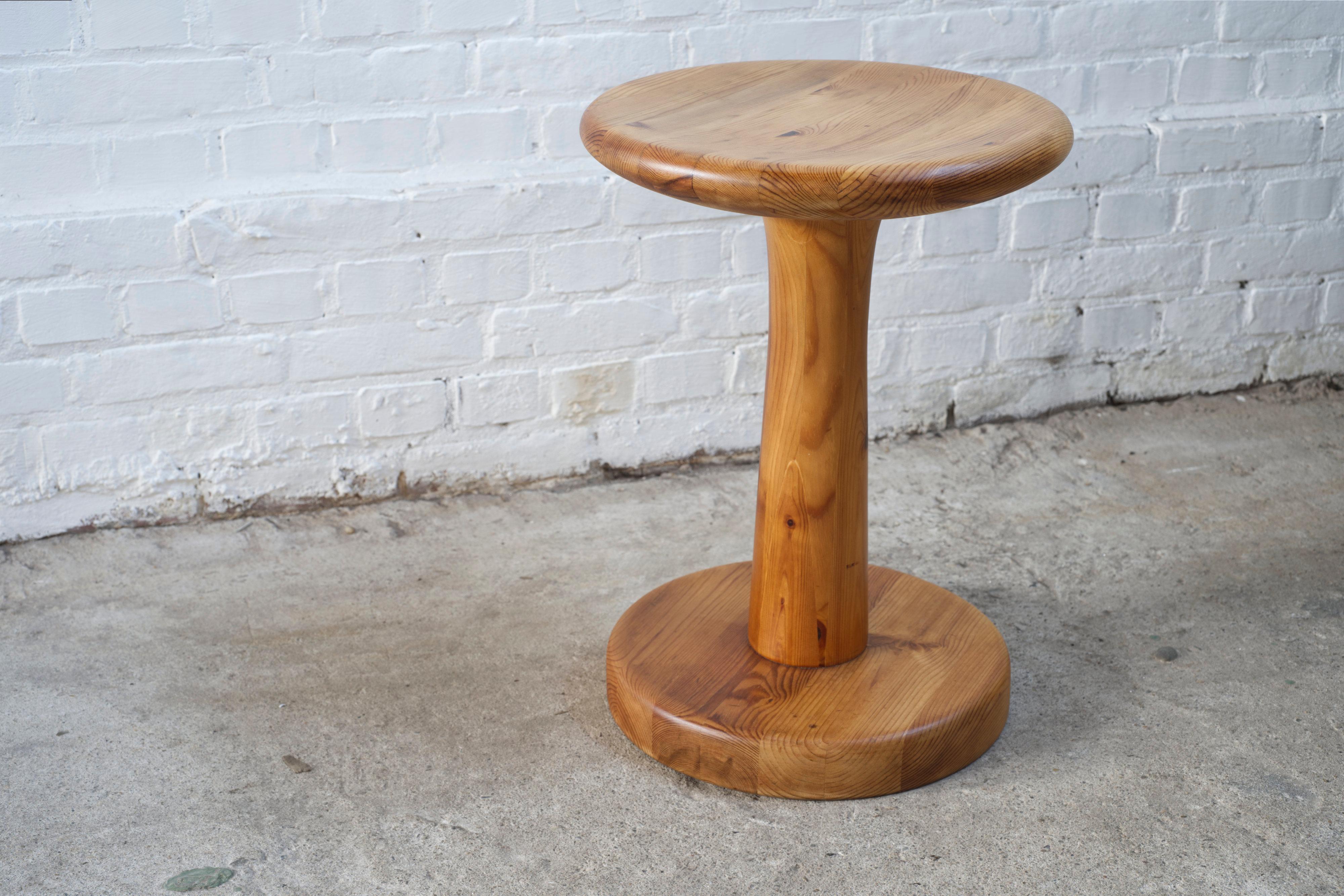 A very functional and elegant pine stool attributed to Rainer Daumiller for Hirtshals 1960s - Denmark. Solid sculpted and turned pine stool. A perfect minimalist and modernist design. Can be used as stool, table, flower stand and footrest.

The