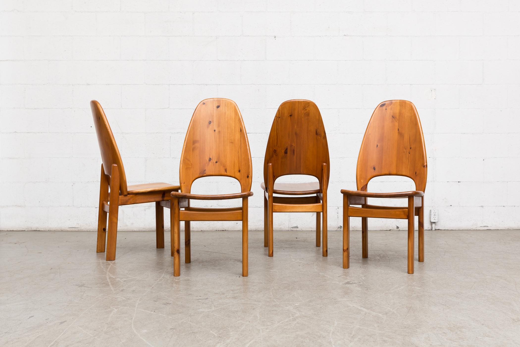 Set of four high back solid pine dining chairs in good original condition with wear consistent with their age. Set price.