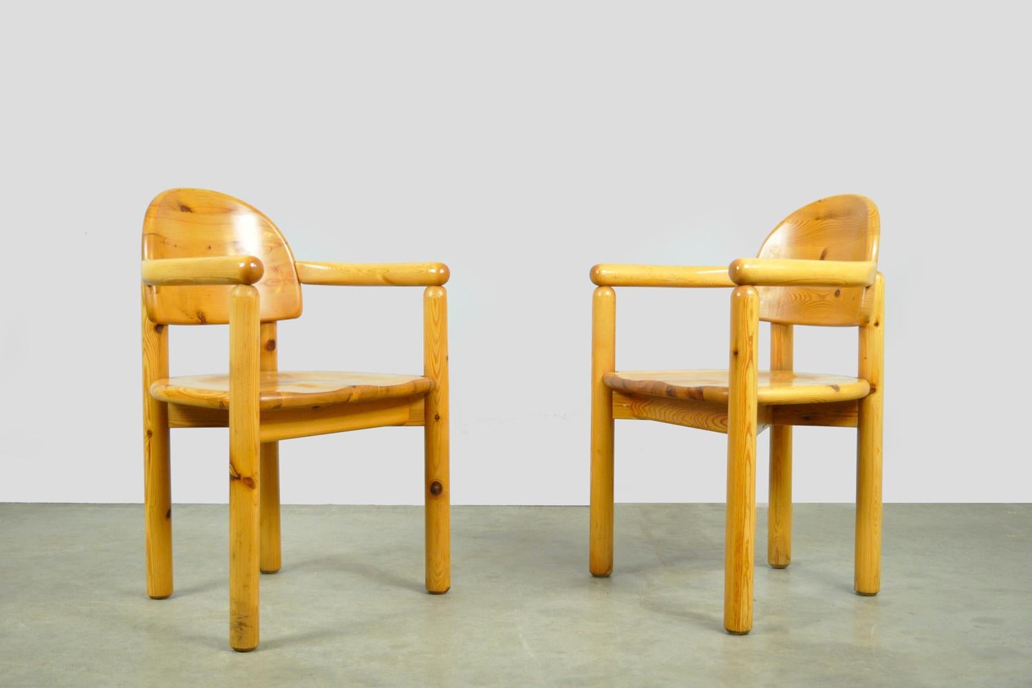Set of 2 brutalist dining table chairs designed by Rainer Daumiller for Hirtshals Savvaerk, 1970s Denmark. The chairs have a frame and seat made of solid pine wood. Pleasant seating comfort due to the shaped seat. Characteristic connection detail of