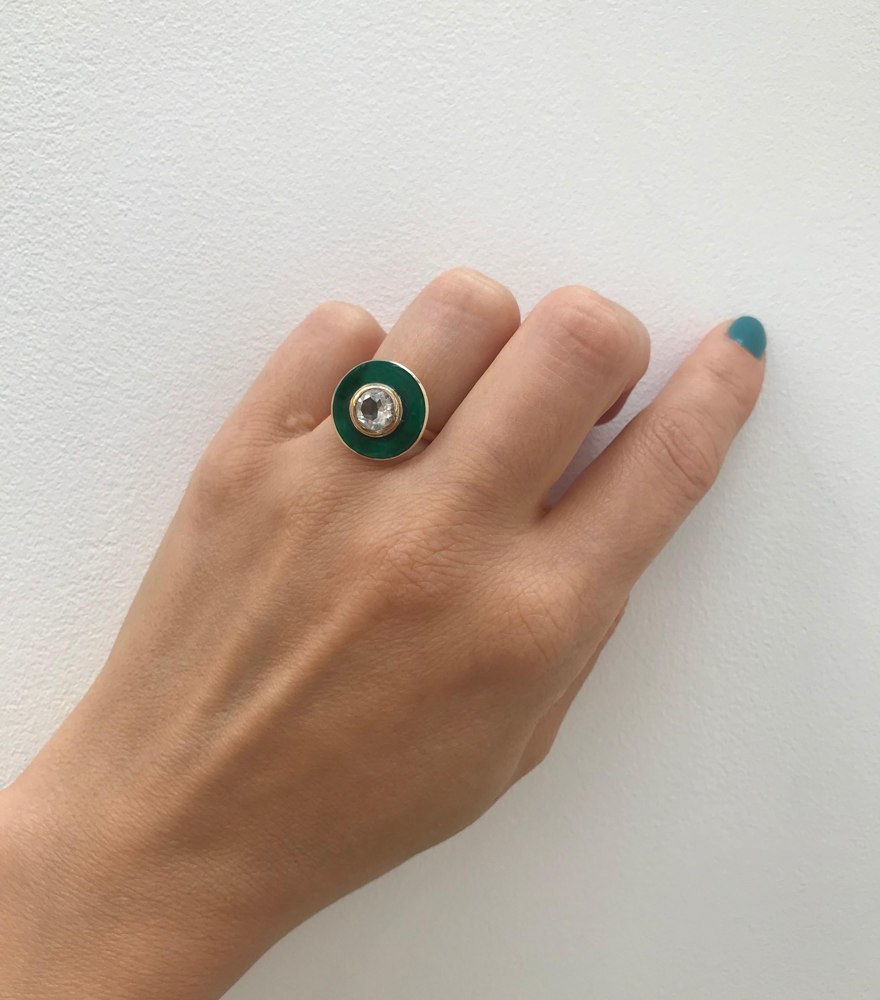 Rooted in clean, classic lines, this a bold yet elegant cocktail ring reflects the individuality of the wearer. Inspired by the rainforest of the Amazon we used yellow gold, white topaz and rainforest green vitreous enamel to celebrate a warm summer