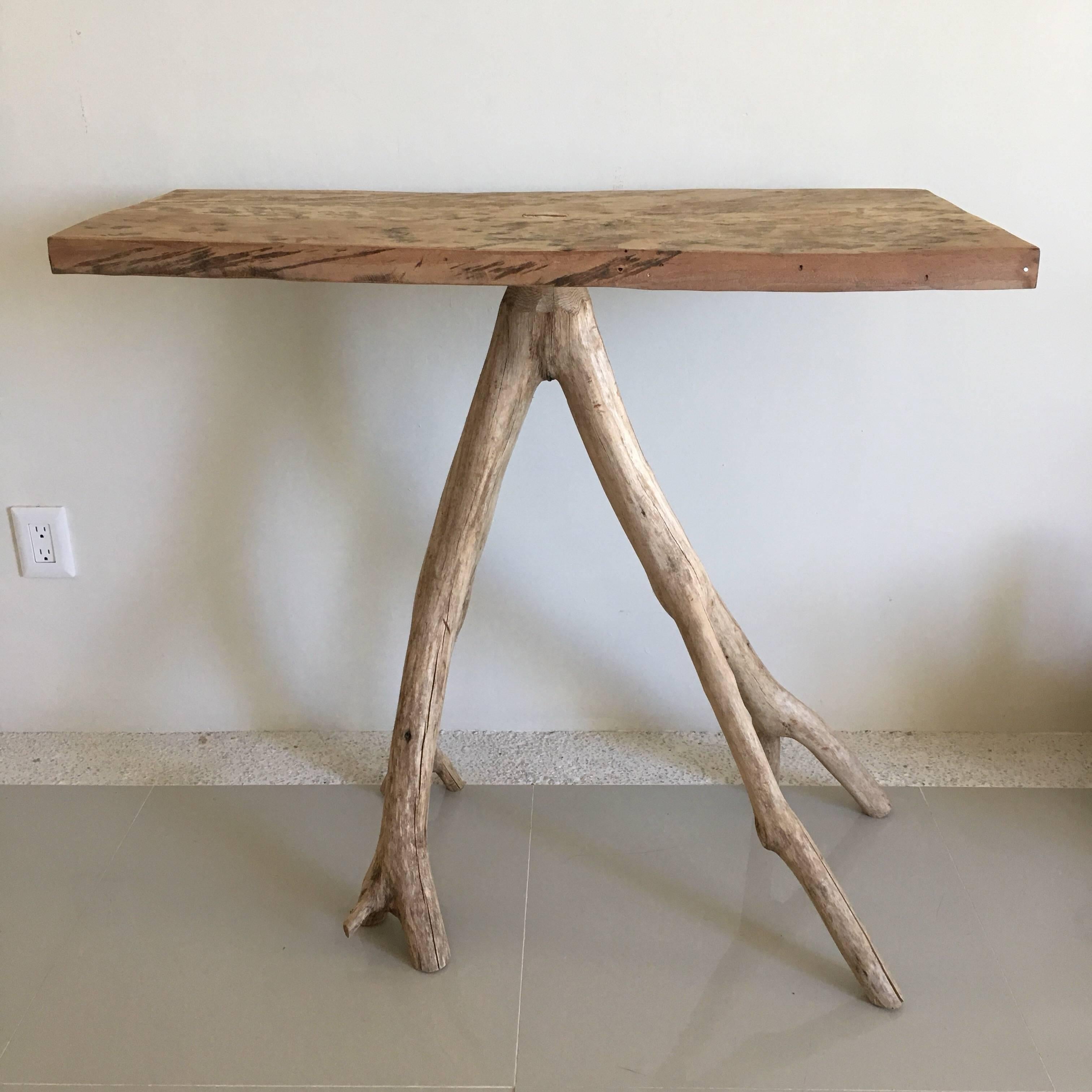 Newly fabricated, two-piece, one-of-a-kind hardwood table from the Jalisco rainforest in a Primitive style.