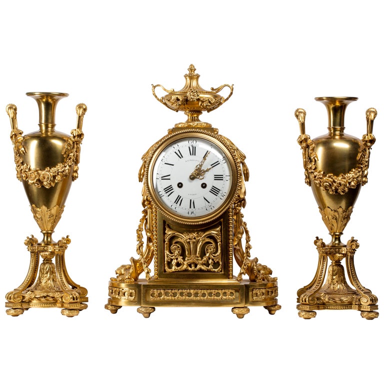 Raingo & Frères Neoclassical Ormolu Clock, Three-Piece Set with Vase Garniture For Sale