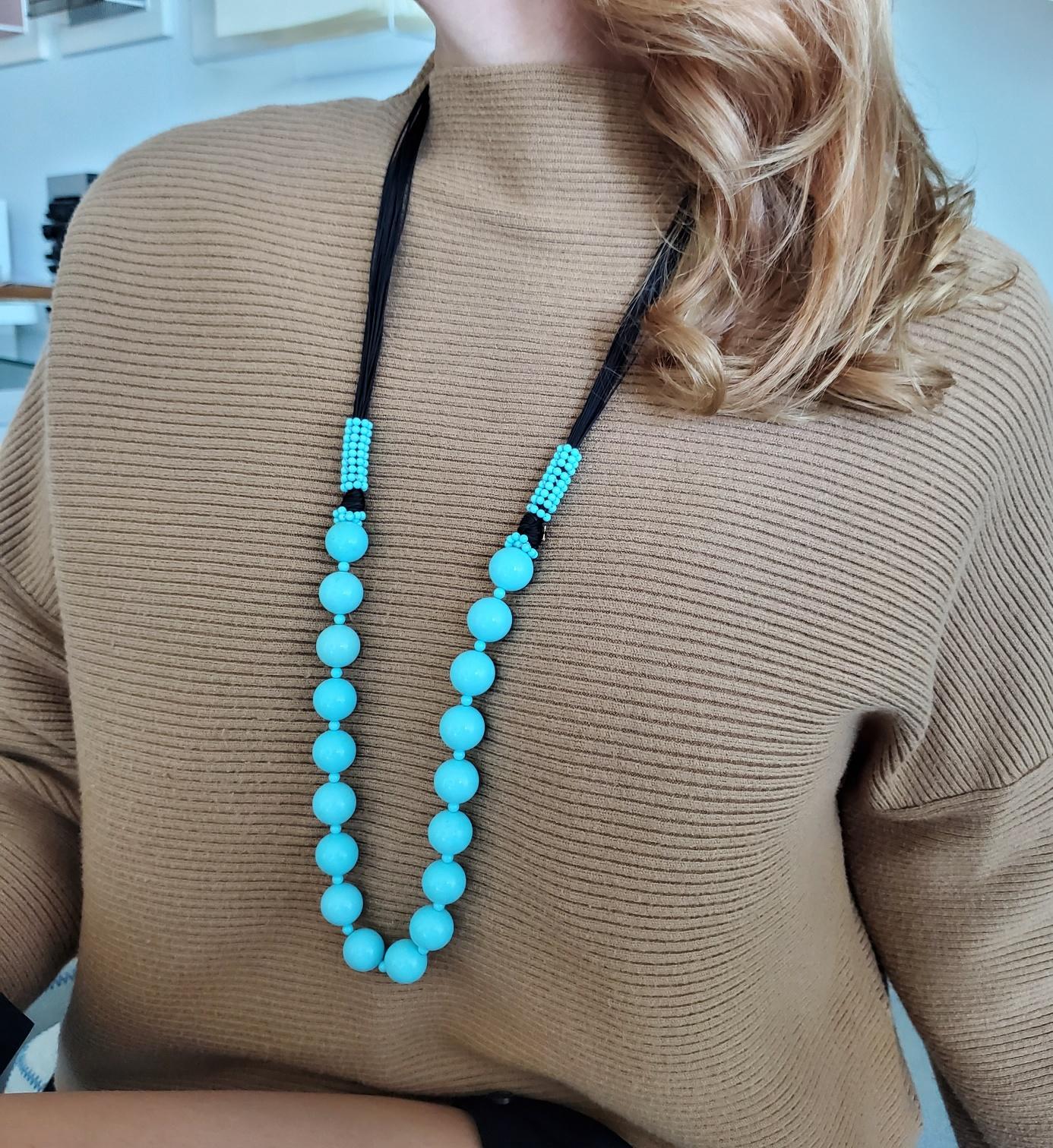 Long sautoir necklace designed by Rajola.

Very beautiful and refreshing piece, created in Italy by the Rajola company. Ideal for the Summer!!. 

Turquoises: Mount with, 18 spheres of blue turquoises.

Birthstone: Turquoises for the month of
