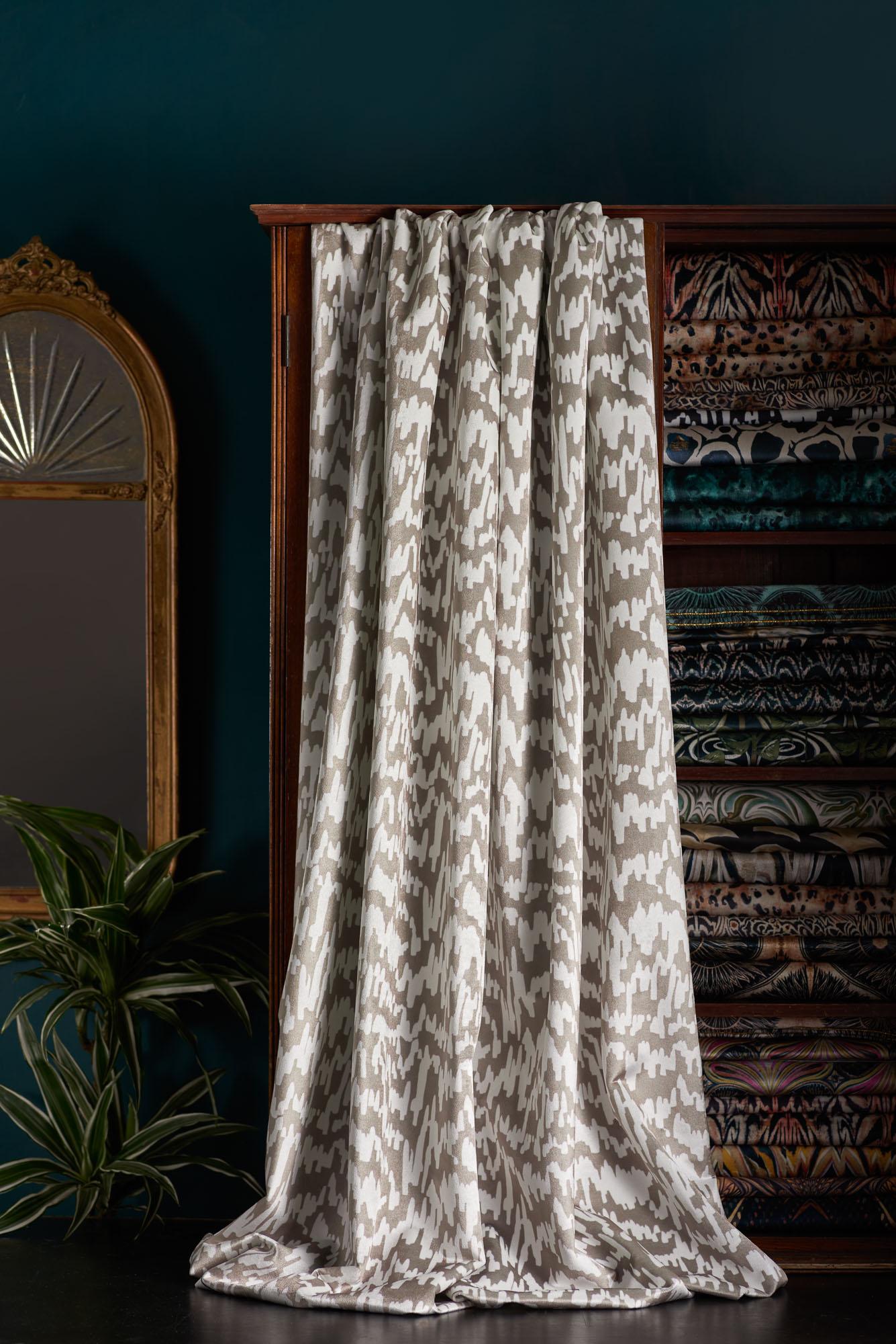 An energetic design by Anna derived from a lino print, in a versatile neutral mushroom tone.

This velvet is thick and luxurious, with a strong straight woven backing. It is suitable for upholstery, but is also light enough for curtains and