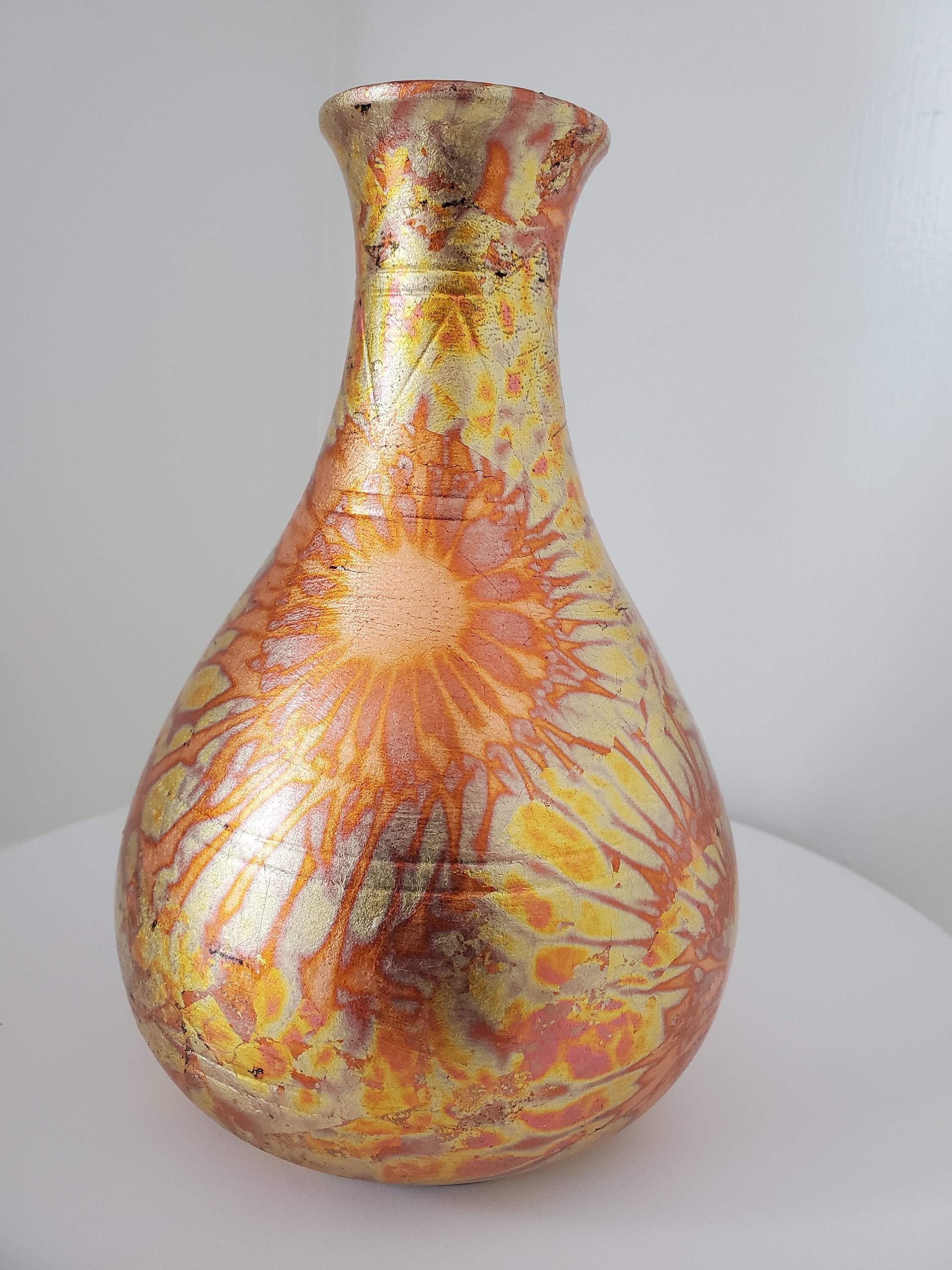 This raku pottery vase from NW Raku Gallery is a stunning addition to any traditional or modern décor, such as art deco, mid-century modern, or farmhouse style. This raku pottery vase was made by the Navajo People in the Northwest United States and