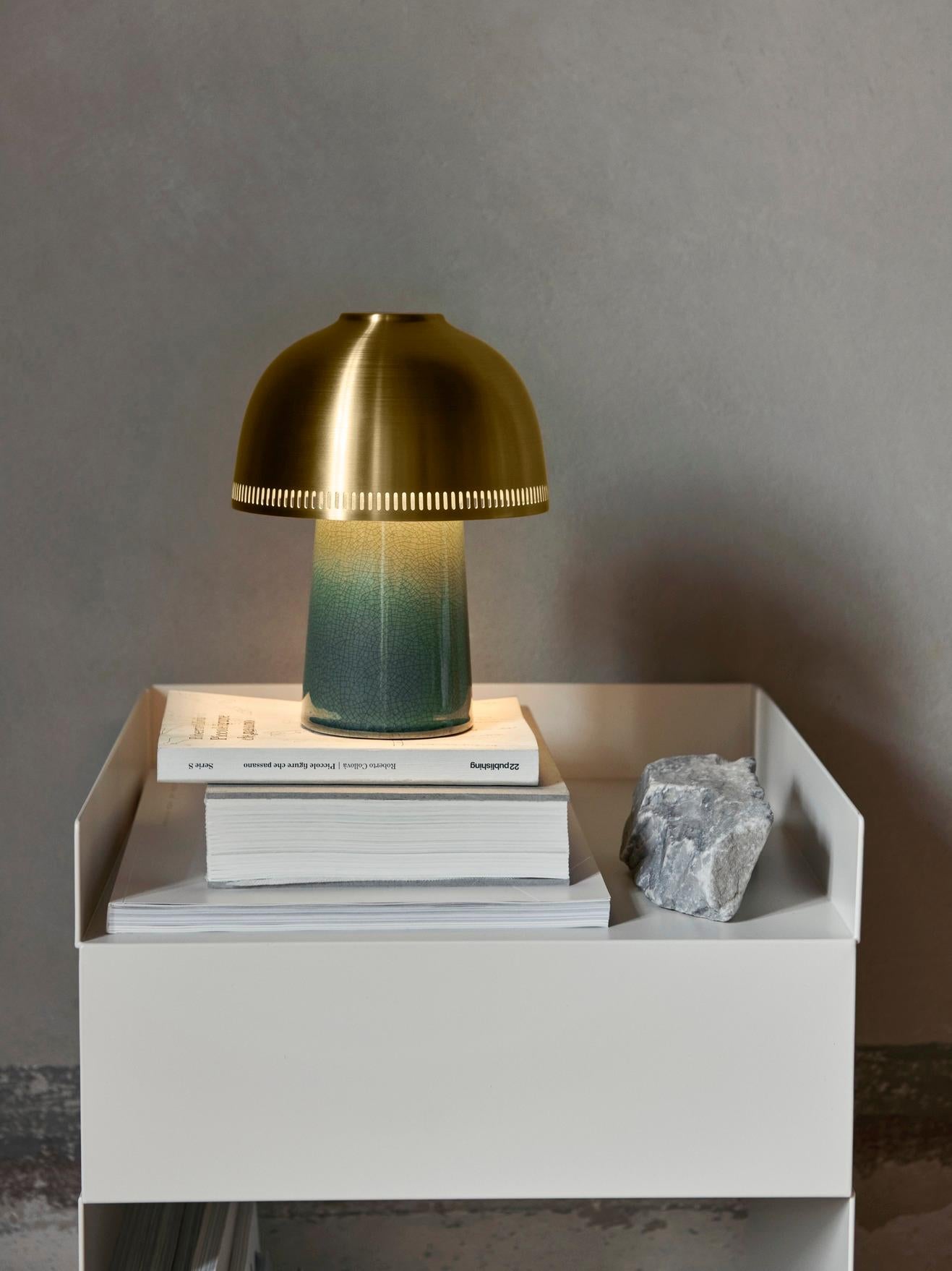 Named after the traditional Japanese pottery technique, Raku is a compact lamp with considerable presence. Drawing inspiration from the age-old art form, the lamp features a hand-sculpted ceramic base with a crackle glaze that varies slightly in
