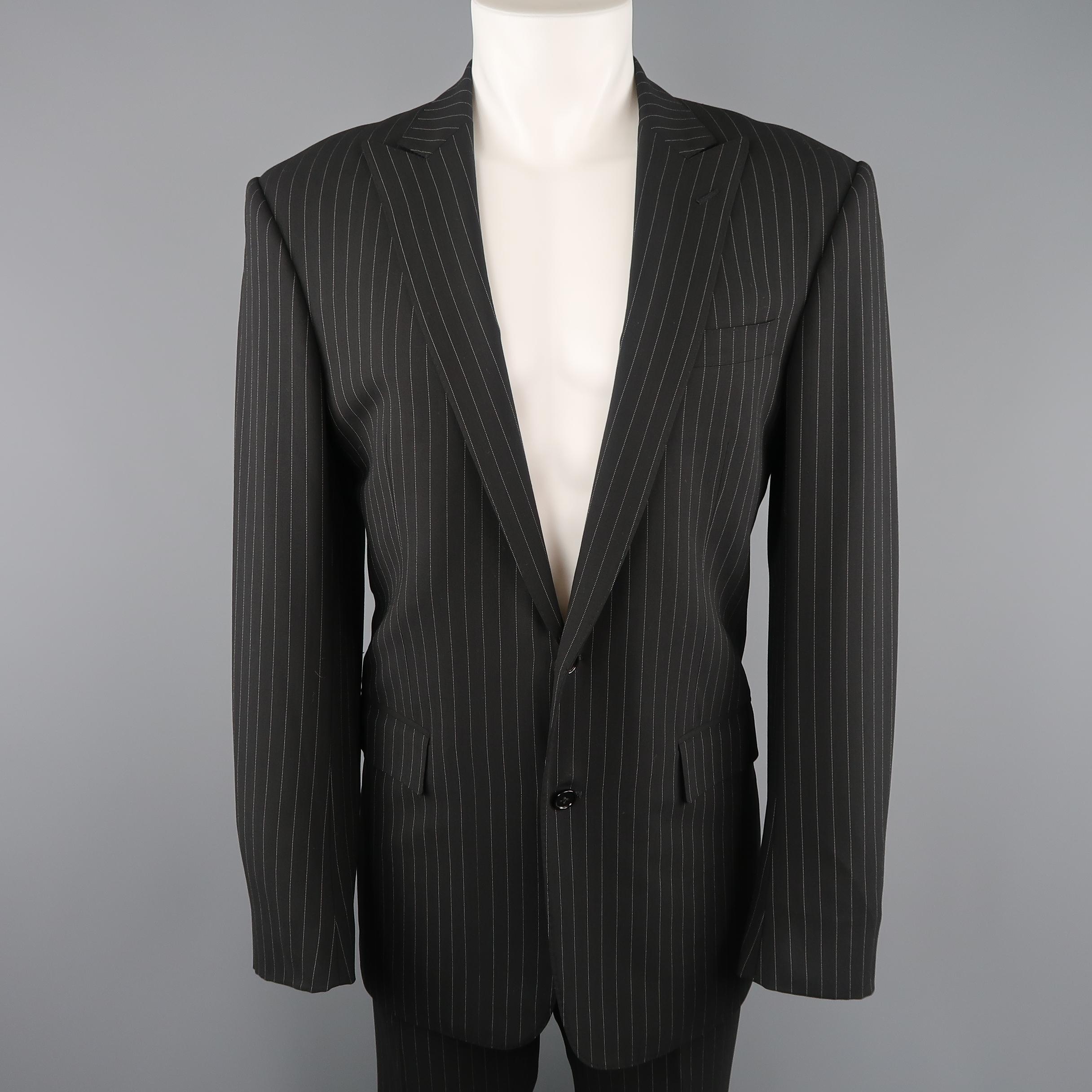 RALPH LAUREN Black Label suit comes in black and white pinstripe wool and includes a single breasted, two button sport coat and matching flat front trousers. Made in Italy.
 
Excellent Pre-Owned Condition.
Marked: 40
 
Measurements:
