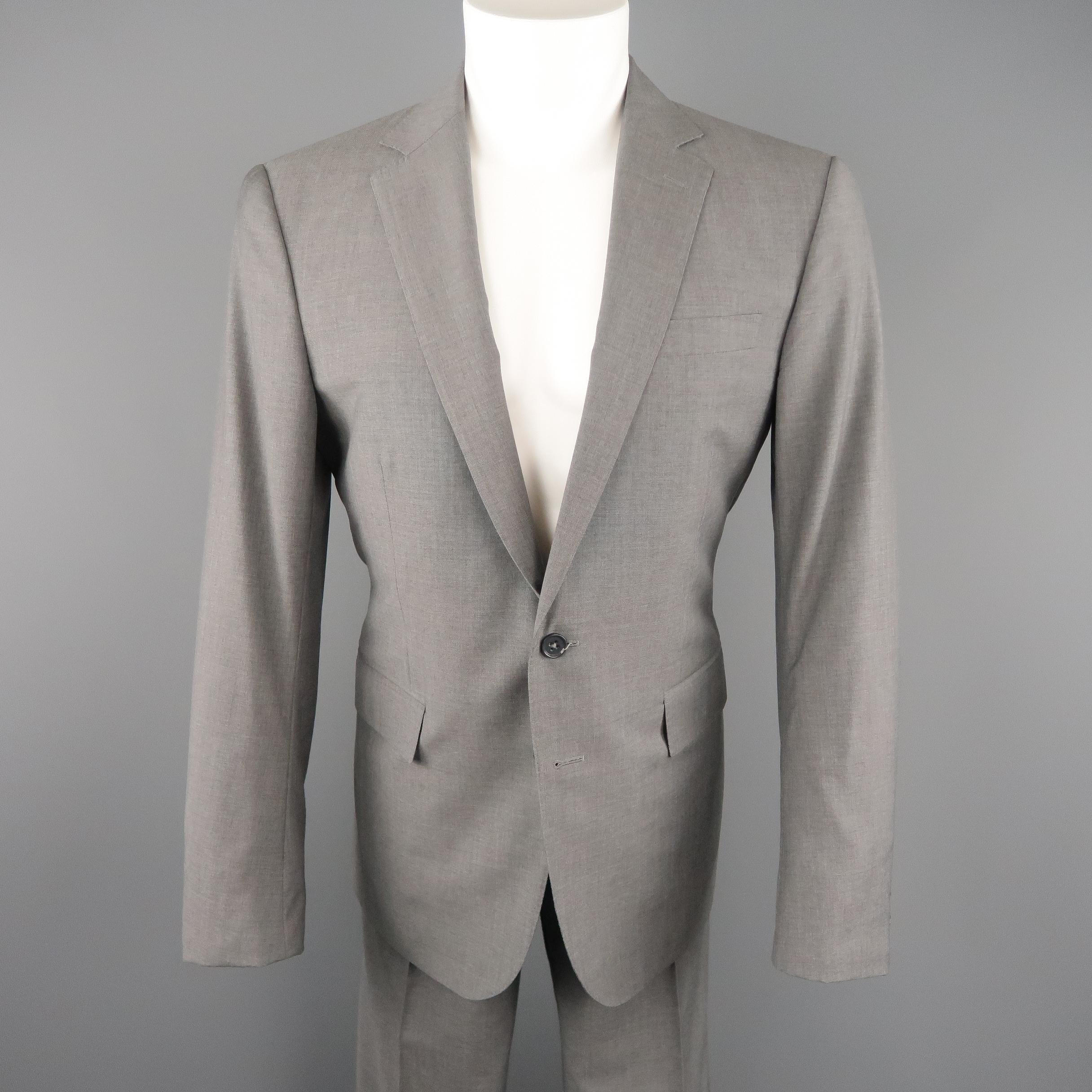 RALPH LAUREN BLACK LABEL suit comes in heather gray wool and includes a single breasted, notch lapel, two button sport coat with matching flat front, side tab trousers. Made in Italy.
 
Excellent Pre-Owned Condition. Retails: $1,800.00.
Marked: 40