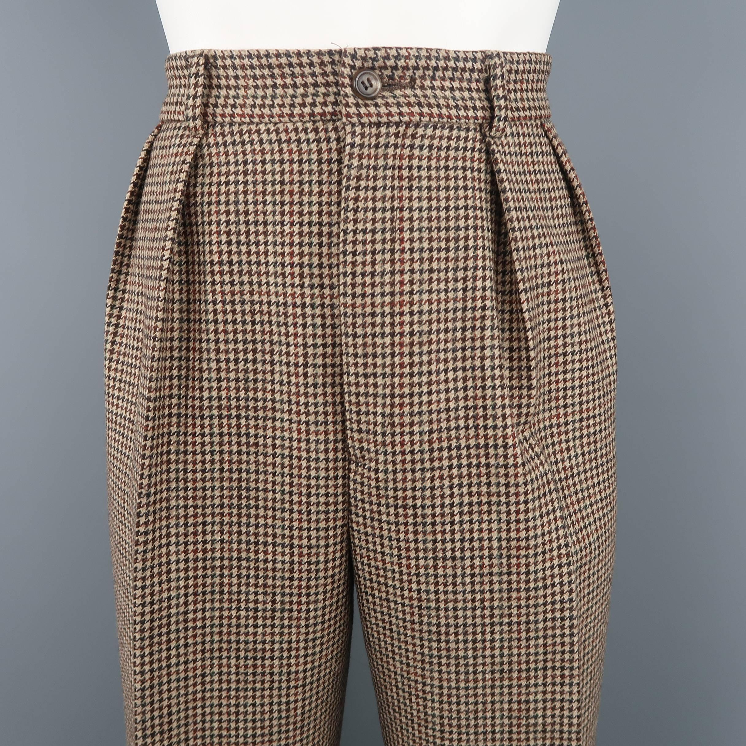 
Vintage RALPH LAUREN COLLECTION trousers come in brown houndstooth print wool with a high rise, pleated front, and cuffed hem. Made in USA.
 
Excellent Pre-Owned Condition.
Marked: 8
 
Measurements:
 
Waist: 26 in. (+ 1 in.)
Rise: 13 in.
Inseam: 33