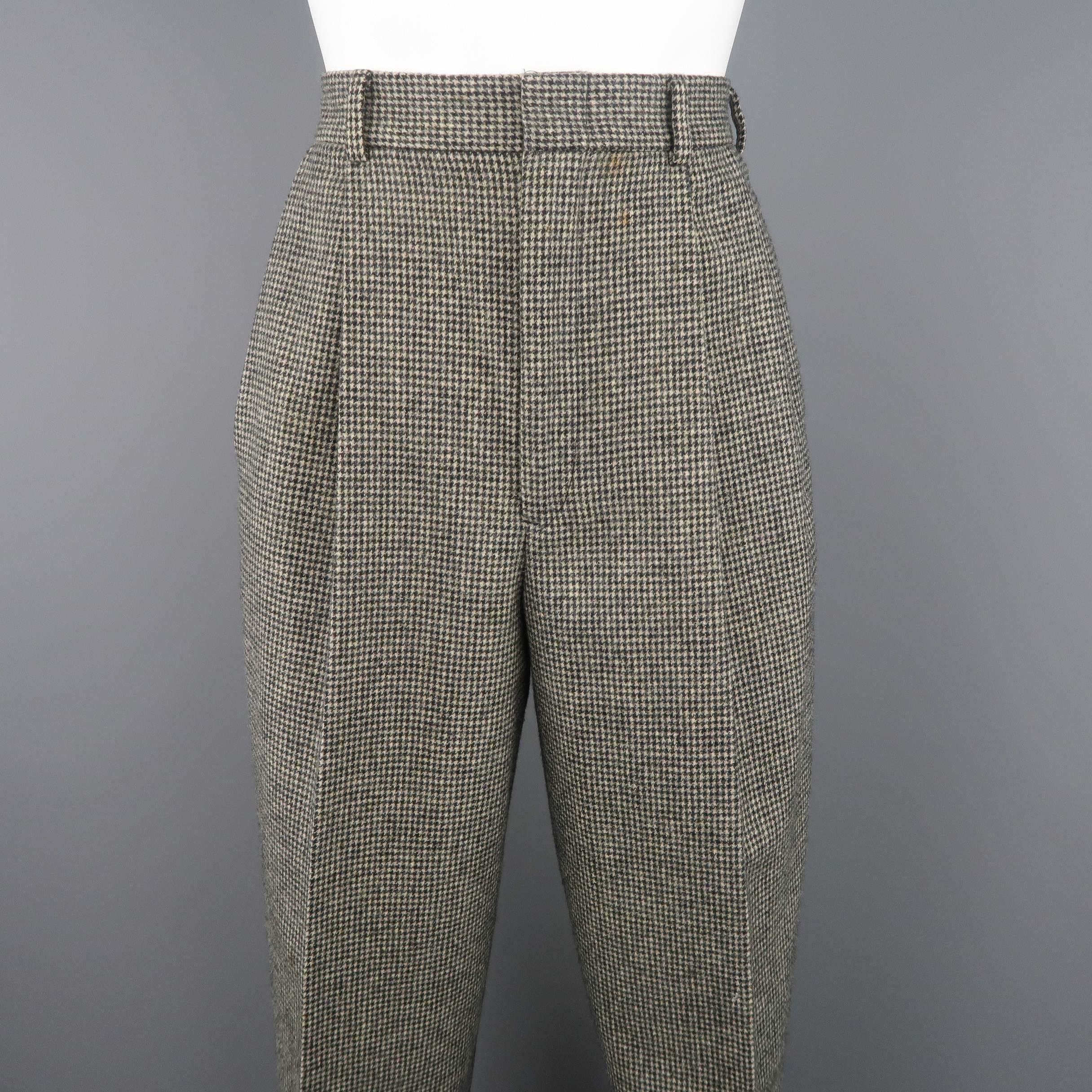 Vintage RALPH LAUREN COLLECTION trousers come in beige and black houndstooth print wool with a high rise, pleated front, and cuffed hem. Made in USA.
 
Excellent Pre-Owned Condition.
Marked: 8
 
Measurements:
 
Waist: 26 in. (+ 1 in.)
Rise: 13