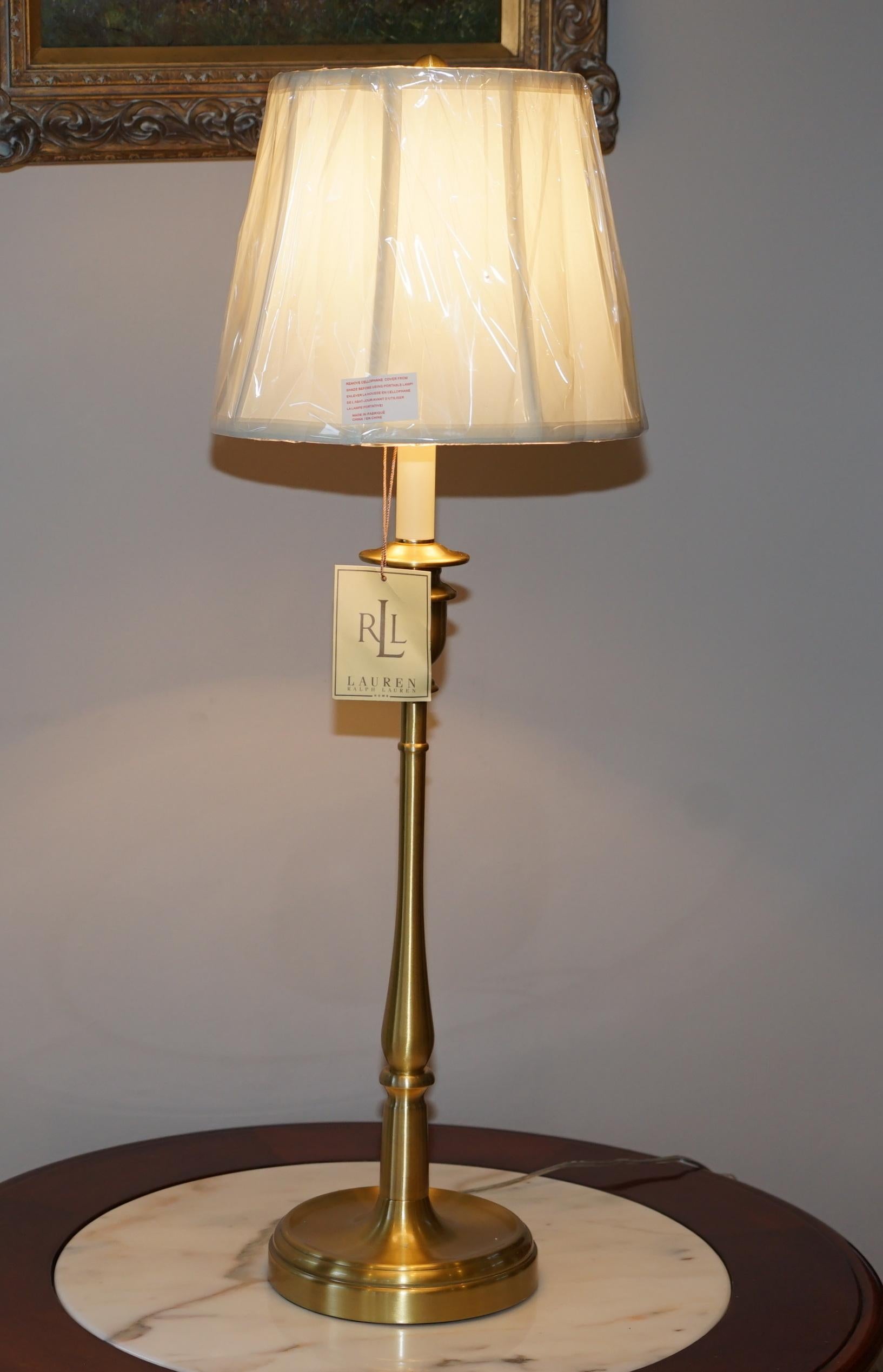 I am delighted to offer for sale one of three brand new in the original box Ralph Lauren brass finish tall candlestick lamp with original shade

I have a number of brand new Ralph Lauren rugs and lamps in stock plus various Tommy Hilfiger bedding