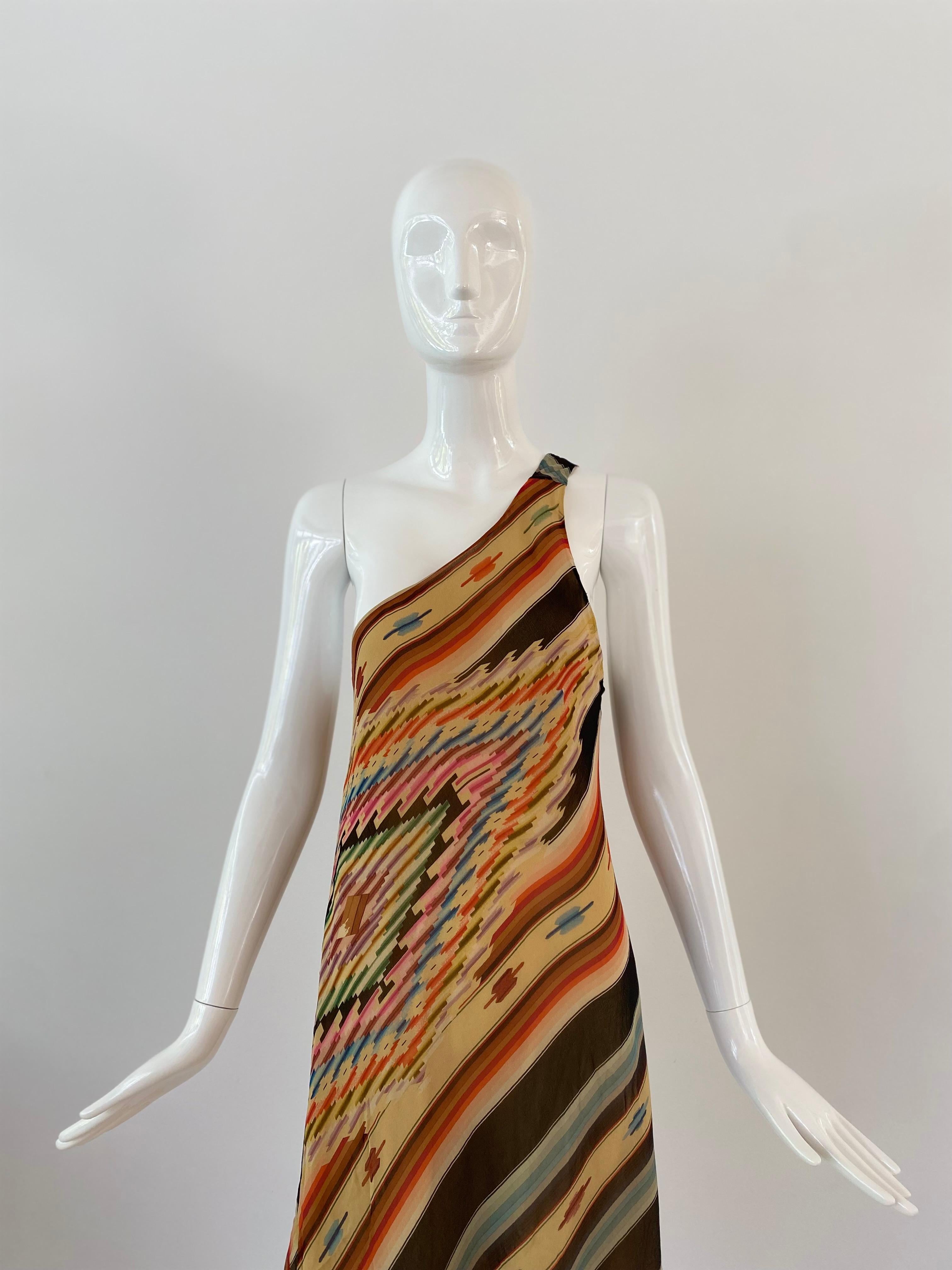 Ralph Lauren Y2K colorful asymmetric dress in their recognizable Southwestern lined print. Done in a soft chiffon silk and lined with a nude silk layer.     Marked as a US size 6, the dress hangs from one shoulder and falls asymmetrically.  This