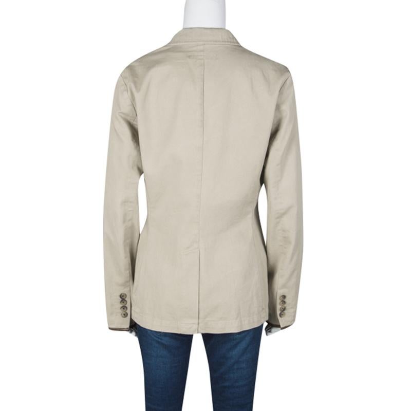 Ralph Lauren's jacket is tailored in a beige cotton body and detailed with leather trims. It features a three-button front and comes with flap pockets on the front. Wear with matching trousers or a pencil skirt for a refined look.

Includes: The