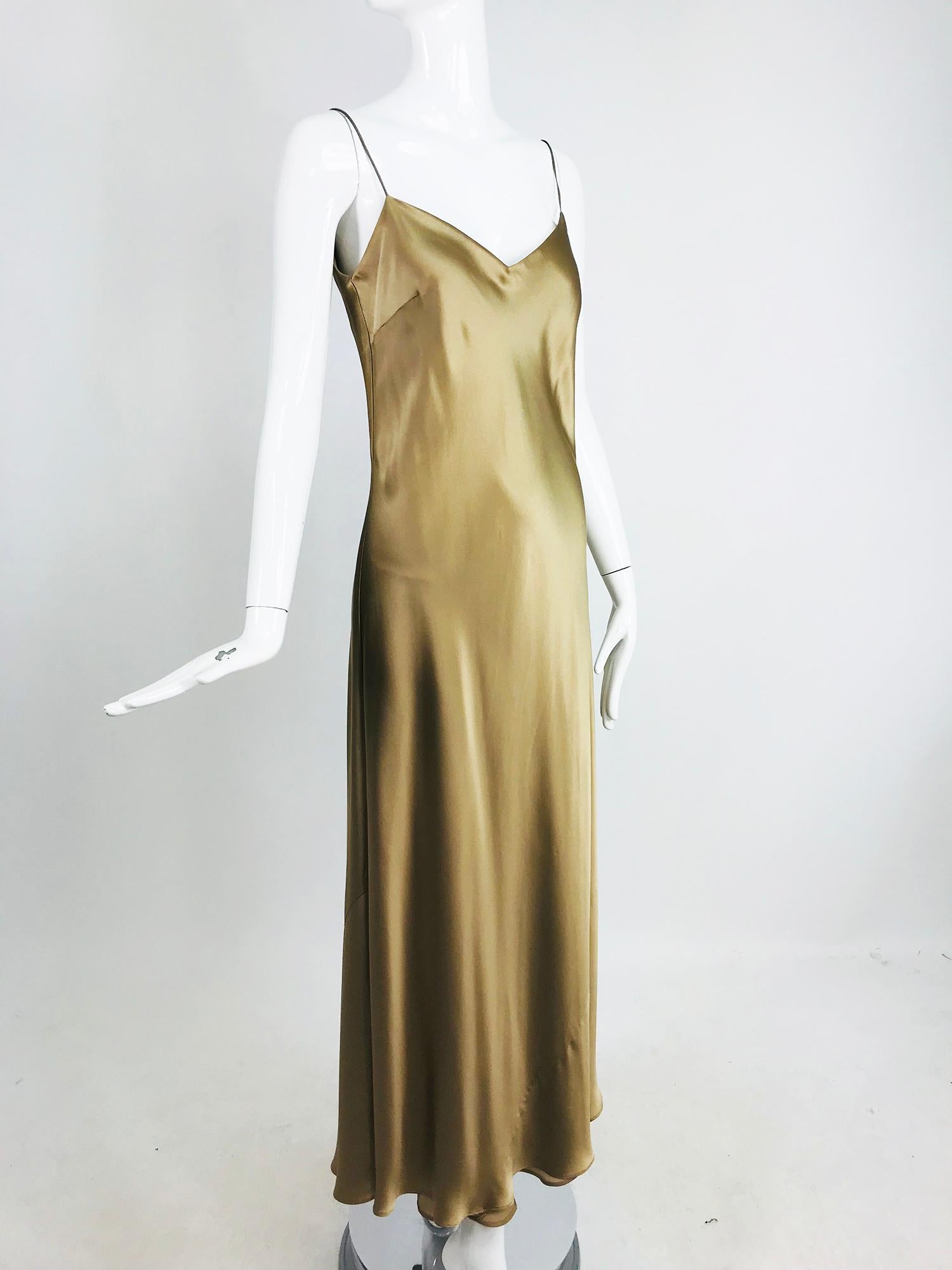 Ralph Lauren Bias Cut Gold Silk Satin Long Slip dress. Shimmery gold silk maxi dress with spaghetti straps is cut on the bias for the figure hugging shape that was famous in the 1930s. This dress is fully lined and marked size 8. V neckline, low