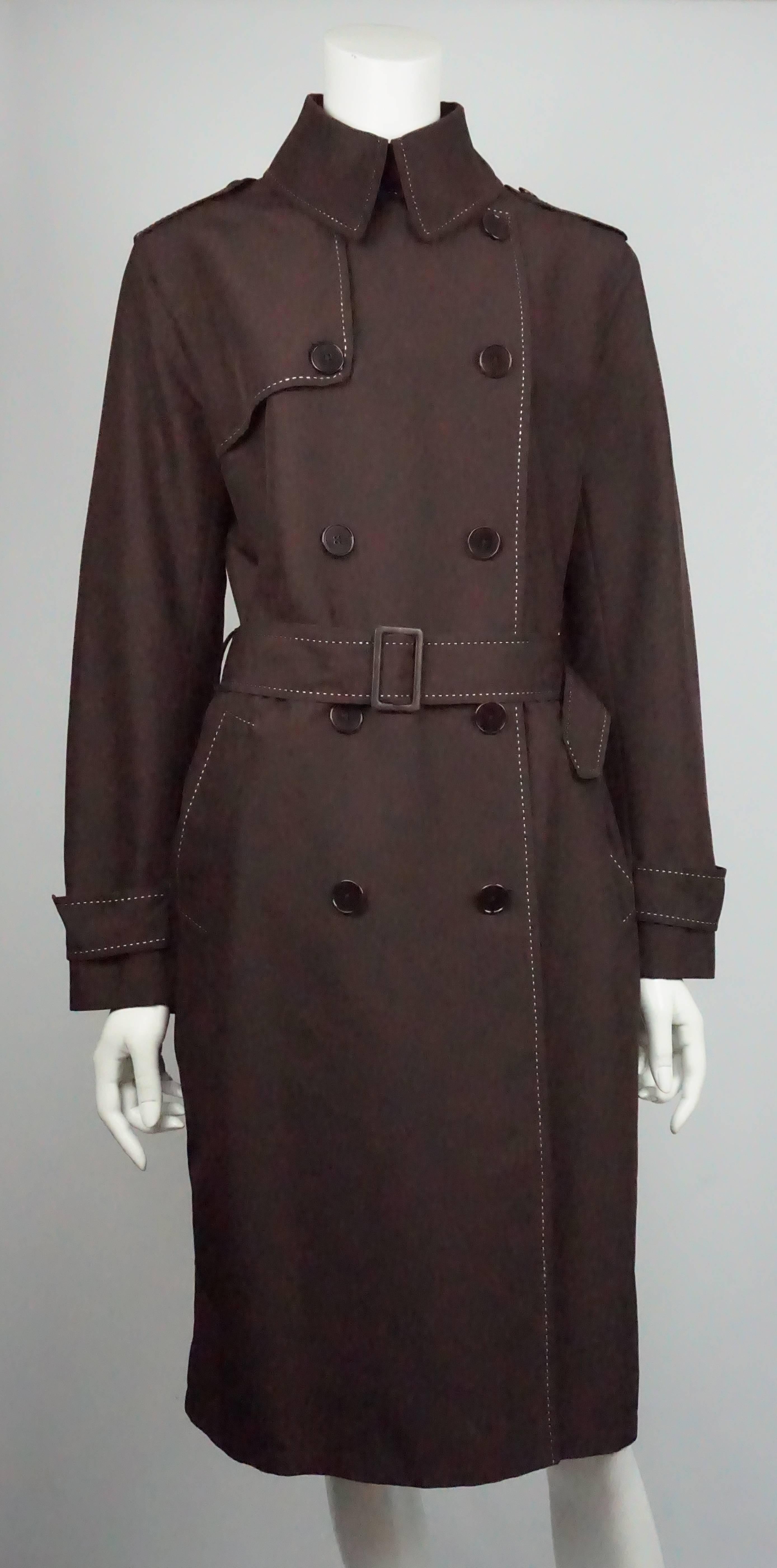 Ralph Lauren BL Brown Rain Coat - 8   This beautiful rain coat is in excellent condition and is made of polyester and rayon. It is double breasted with beautiful details of white stitching around the collar, the lapels, and all the way down the