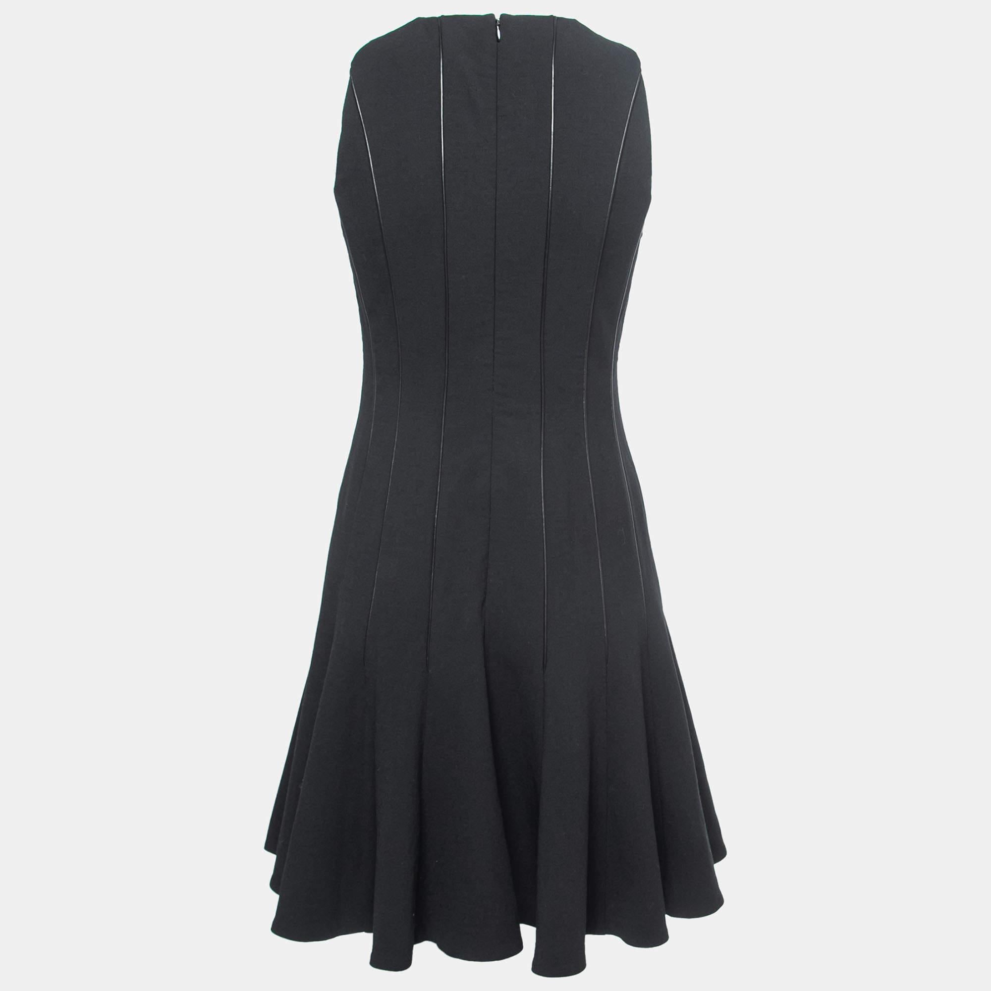 Effortlessly made into a chic design, this Ralph Lauren dress is easy to wear and easy to accessorize. Tailored beautifully, the dress has a simple neckline, back zipper, and flared skirt. It is sure to remain a favorite season after