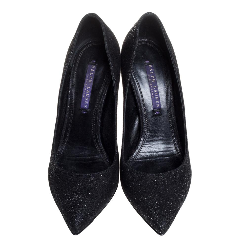 Add a subtle touch of glam to your look by donning these glitter pumps. This pair of Ralph Lauren pumps are more than just a basic fashion statement. They come with pointed toes and stiletto heels. This pair of gorgeous black pumps are complete with