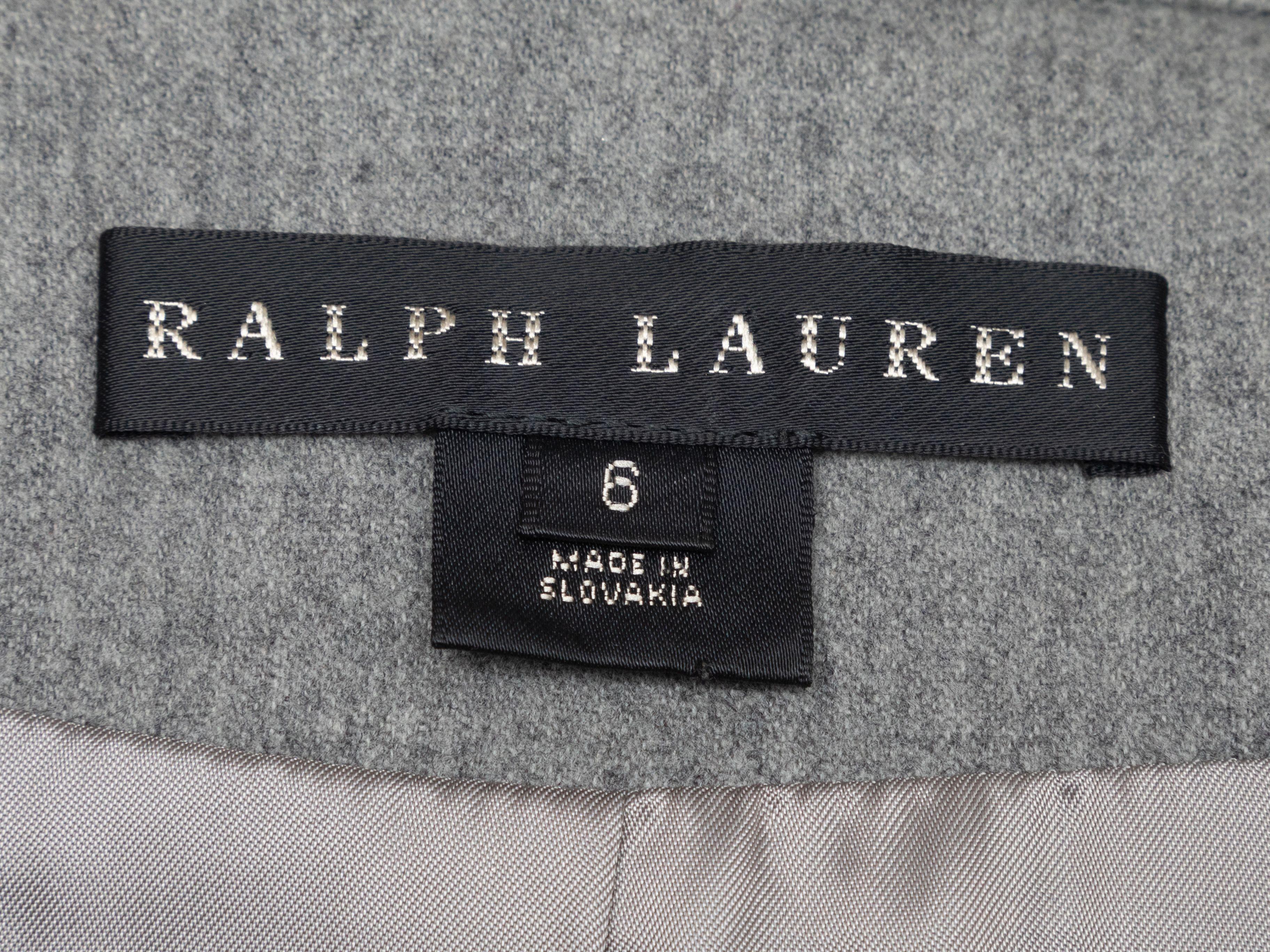 Product Details: Grey wool and cashmere-blend moto jacket by Ralph Lauren Black Label. Silver-tone hardware. Four zip pockets. Buckle accents at waist. Front zip closure. 34